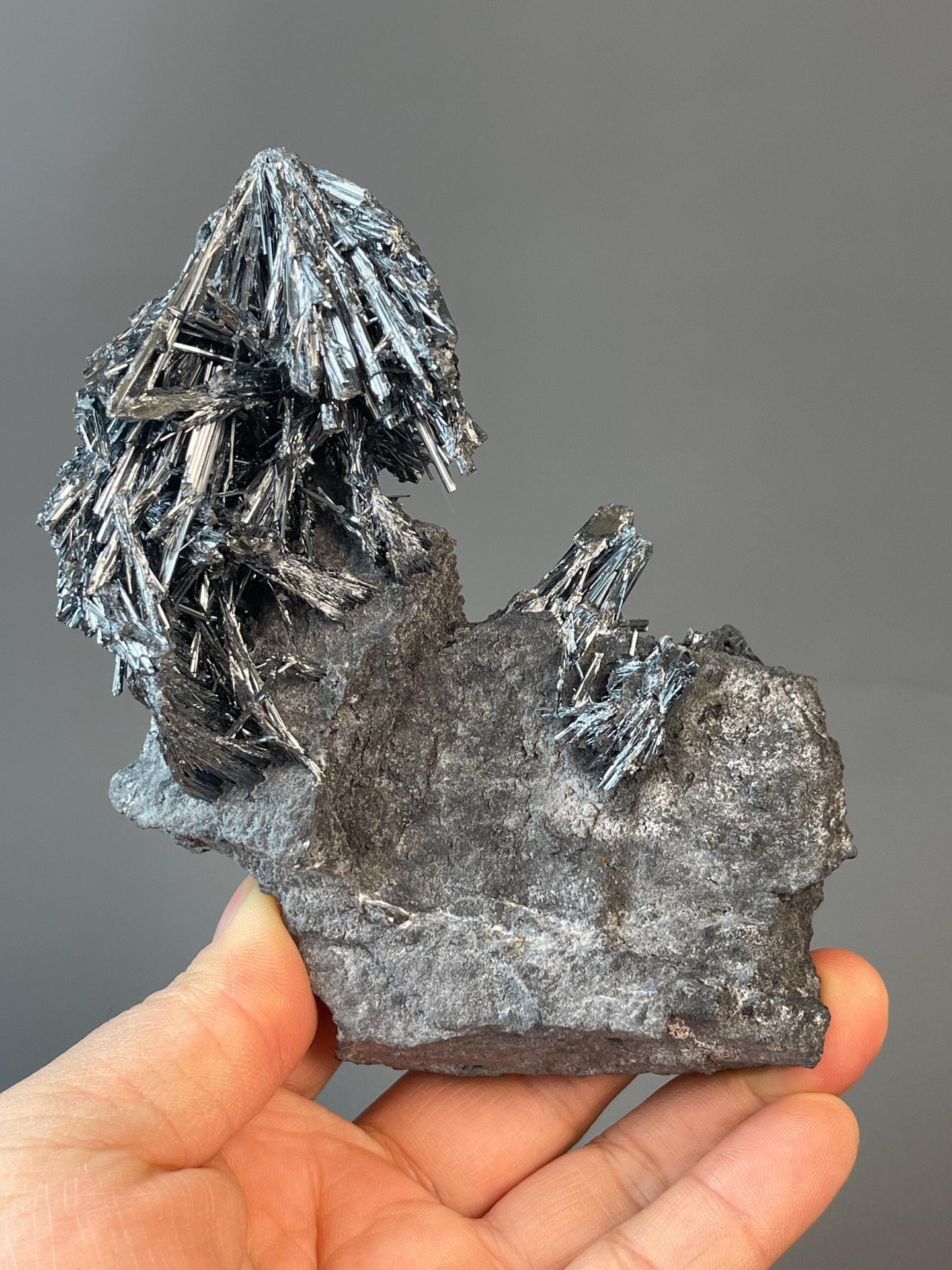 Side view of stibnite formation on rock matrix
