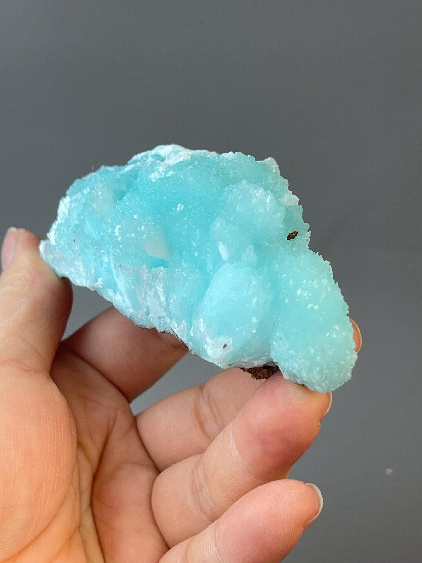 White calcite-like inclusions contrasting vivid blue azurite