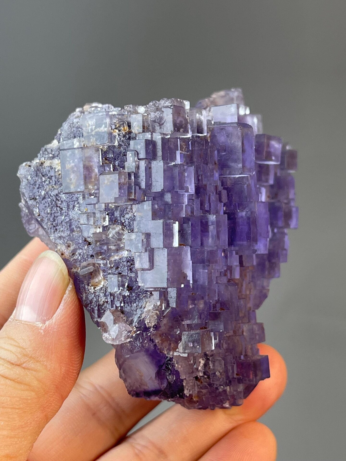 Transparent windows of stepped fluorite specimen