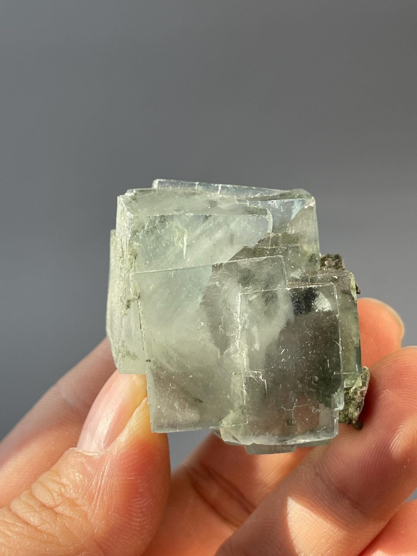 Side view of light green fluorite twin crystal