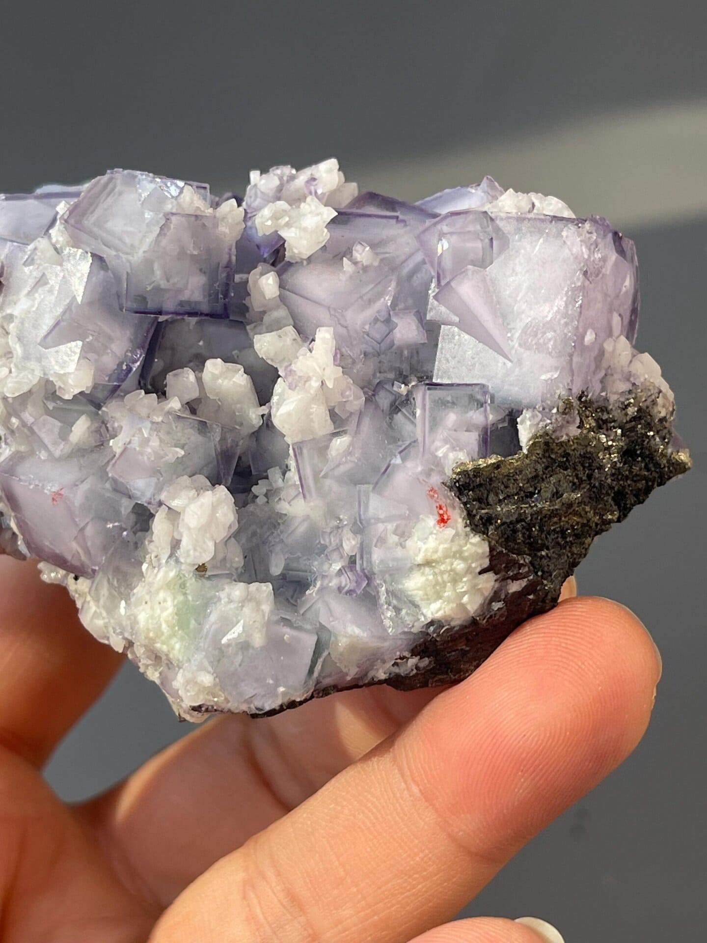 Vitreous luster on purple fluorite crystal faces