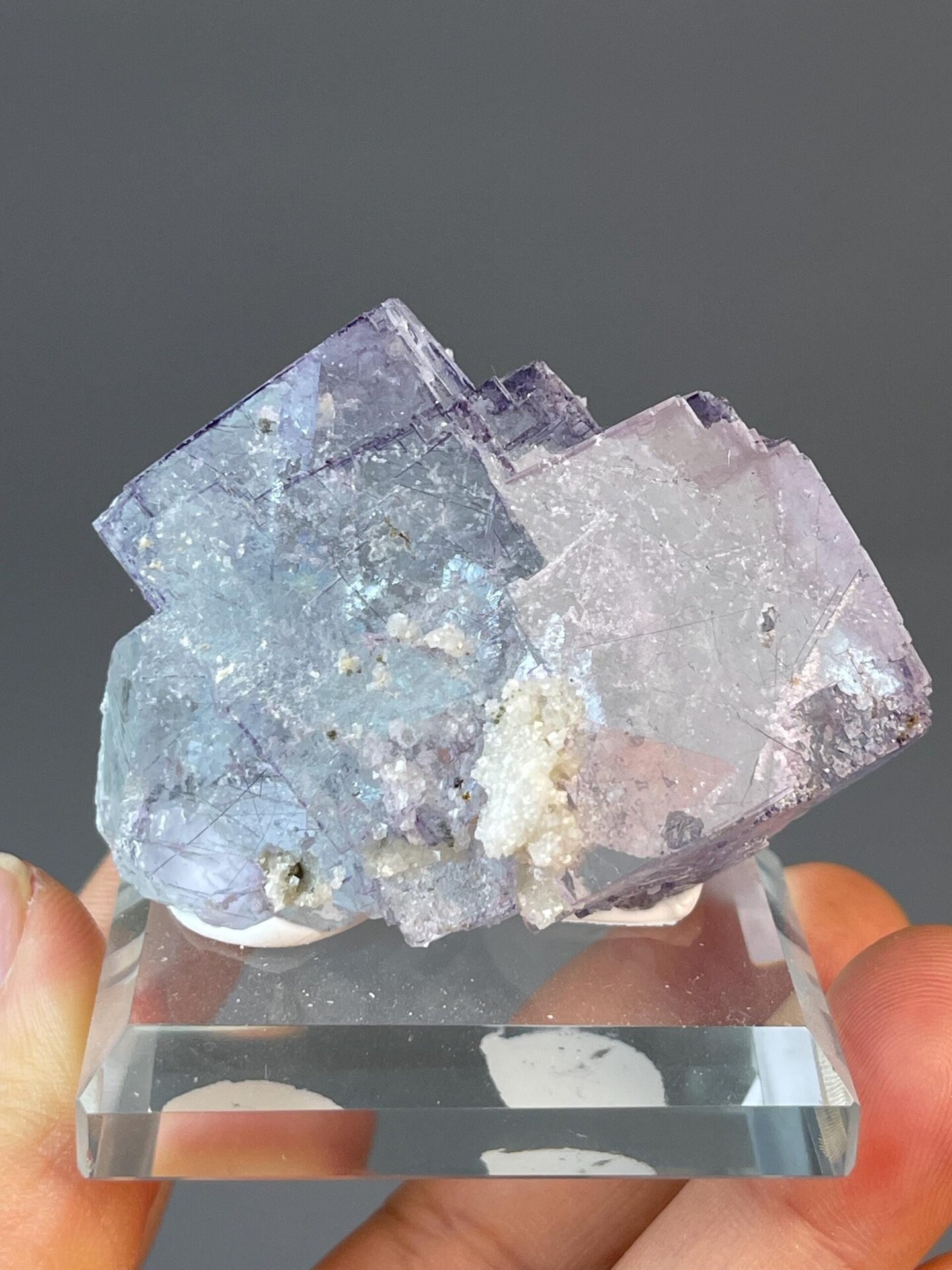 Blue-purple stepped fluorite with silver metallic needle inclusions