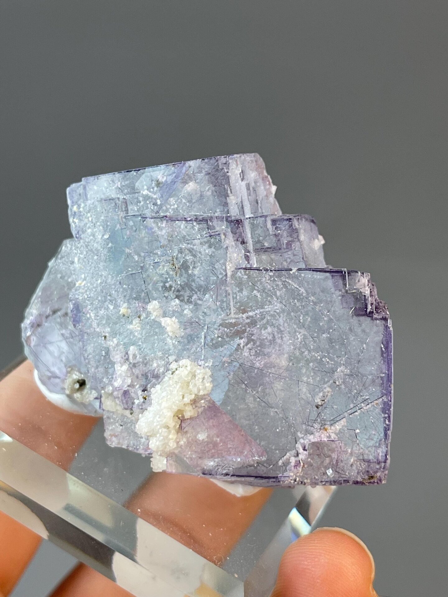 Blue-purple fluorite with large stepped crystal and silver needles