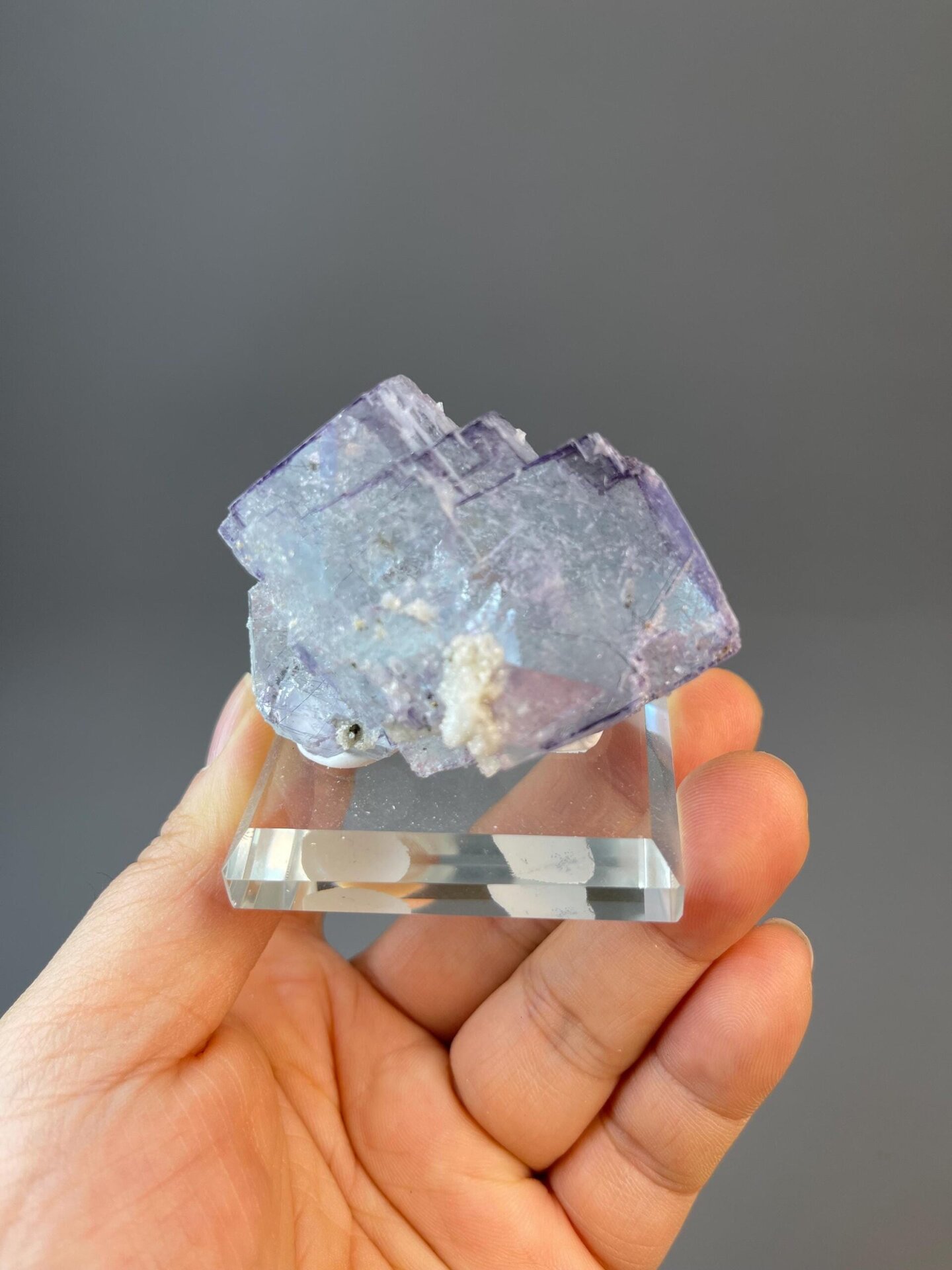 CaF₂ isometric fluorite with stepped cubic faces and needle inclusions