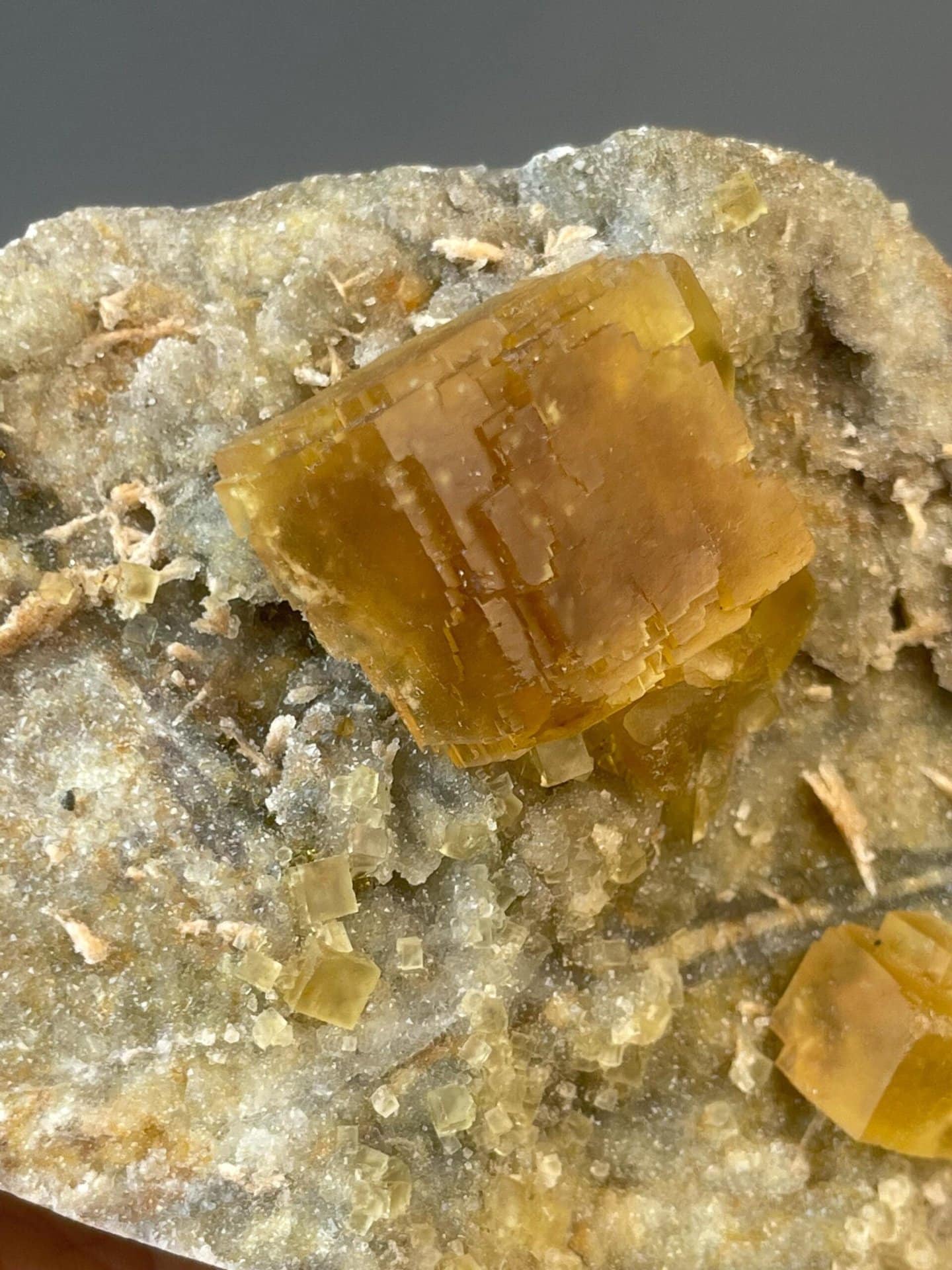 Golden fluorite cluster measuring 4.2×3.9×2.2 inches