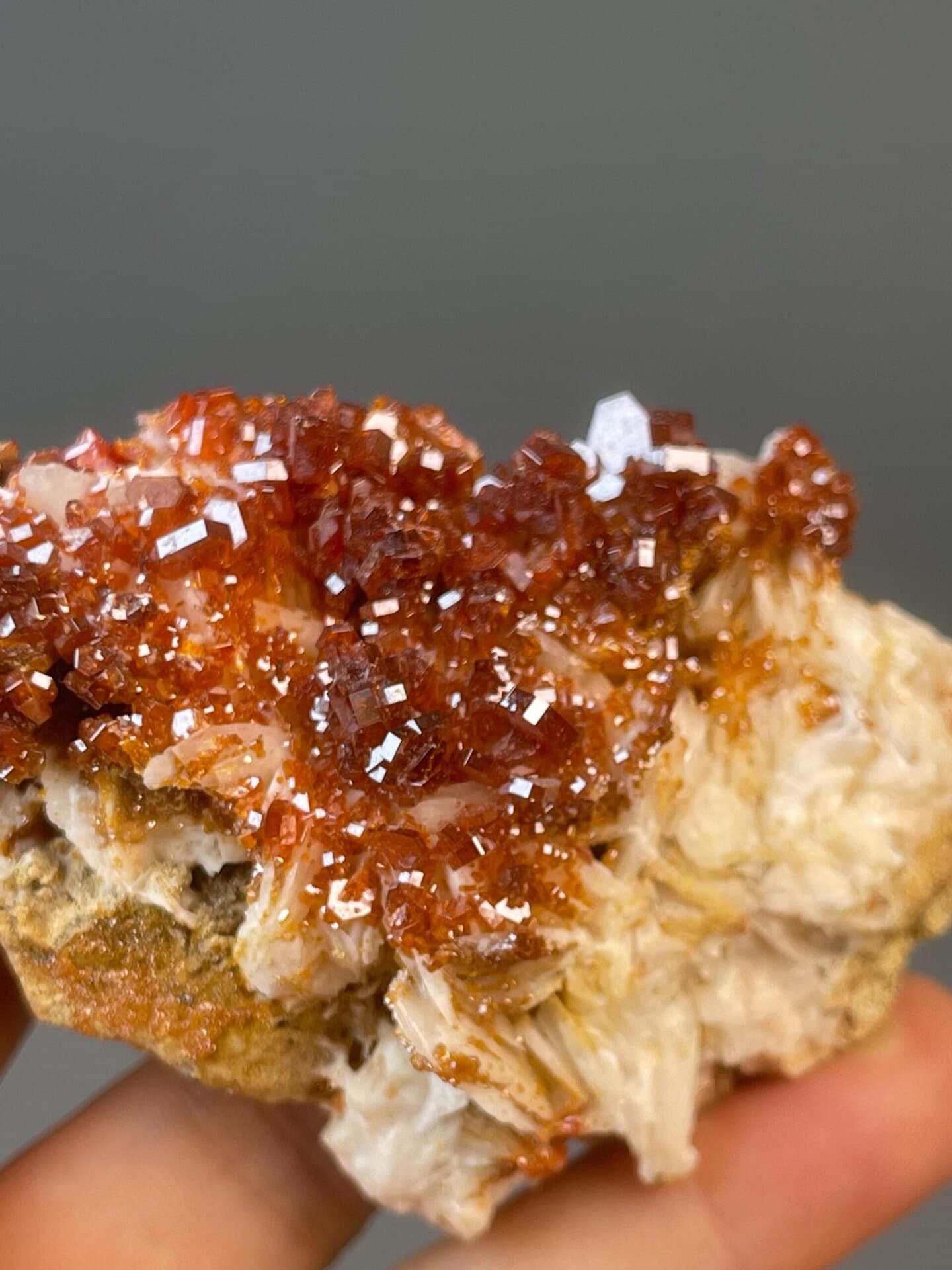 Vanadinite with hexagonal prism habit on iron matrix, Morocco