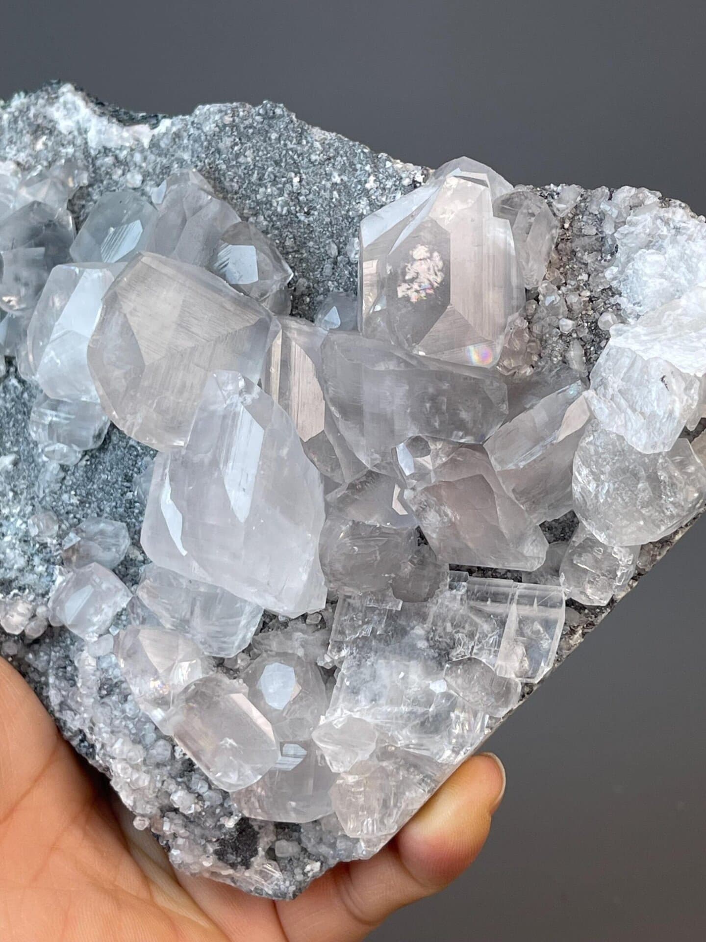 Bright white calcite cluster with multiple crystal terminations