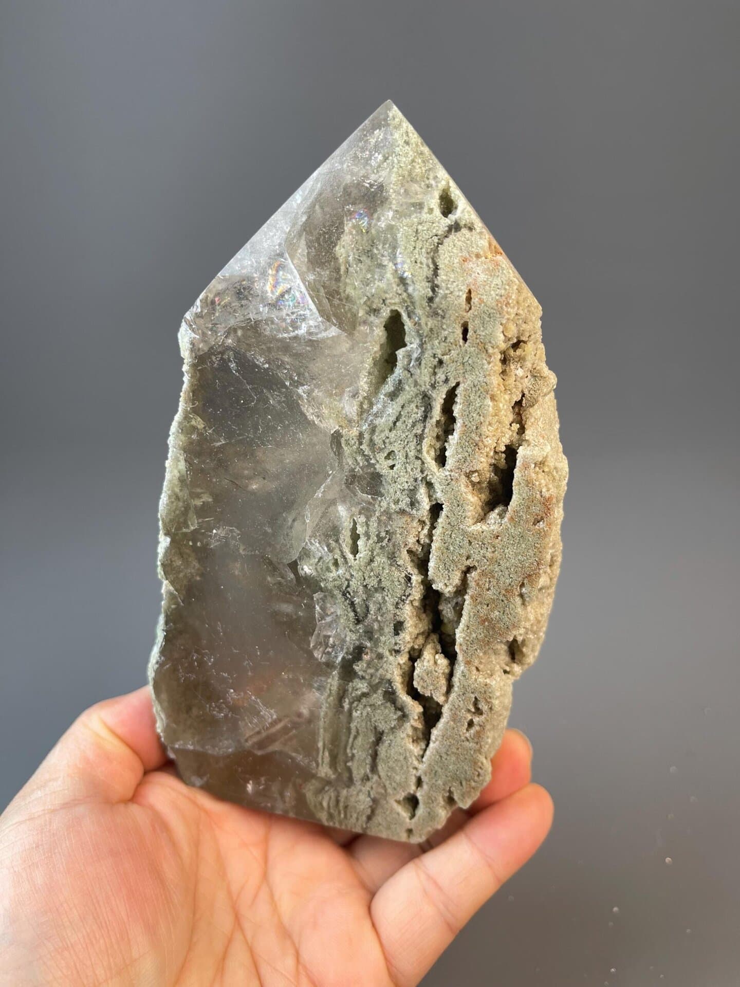 Artisan-carved calcite tower with natural mineral banding