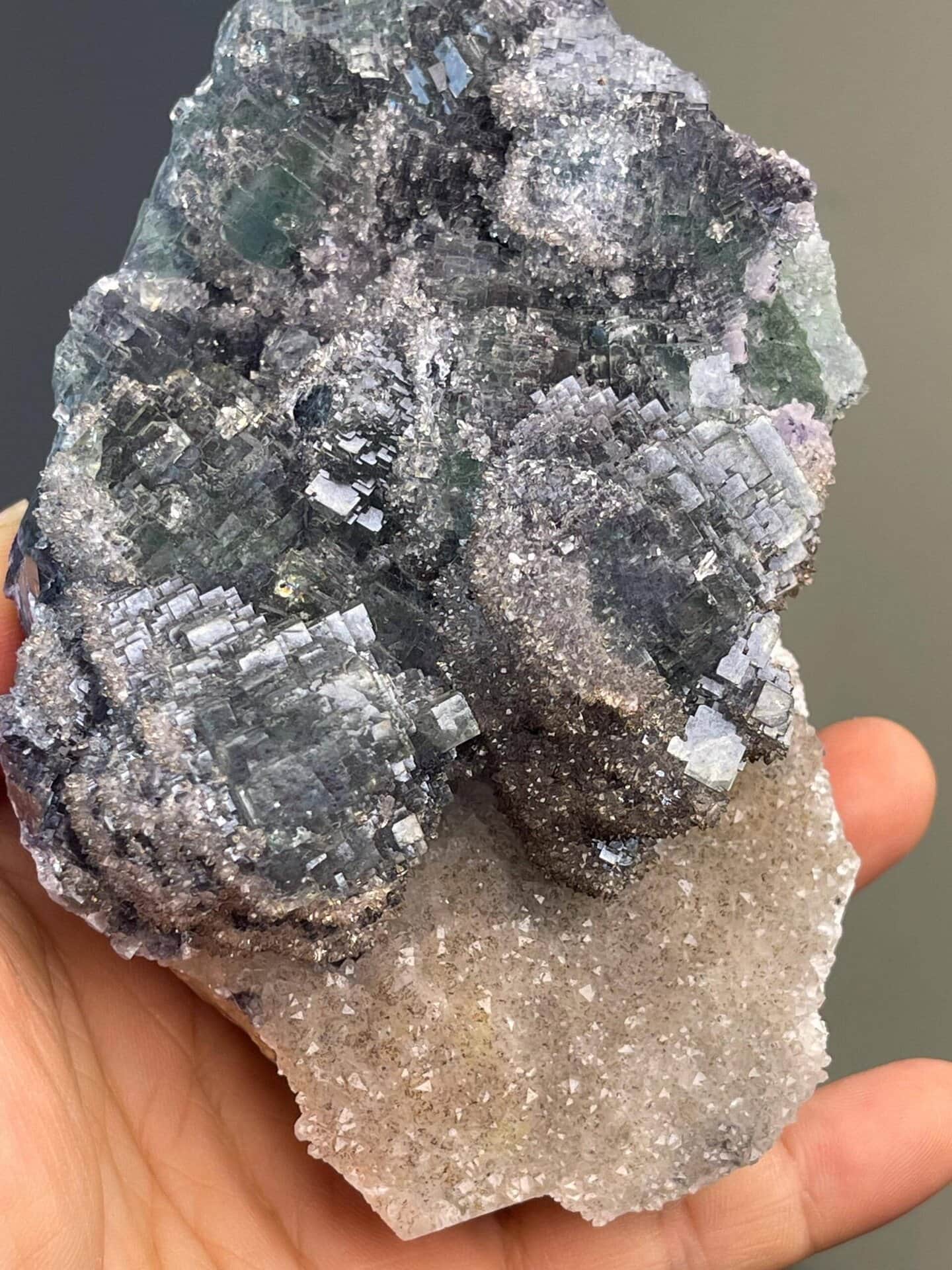 Green fluorite in rounded globular form on quartz base