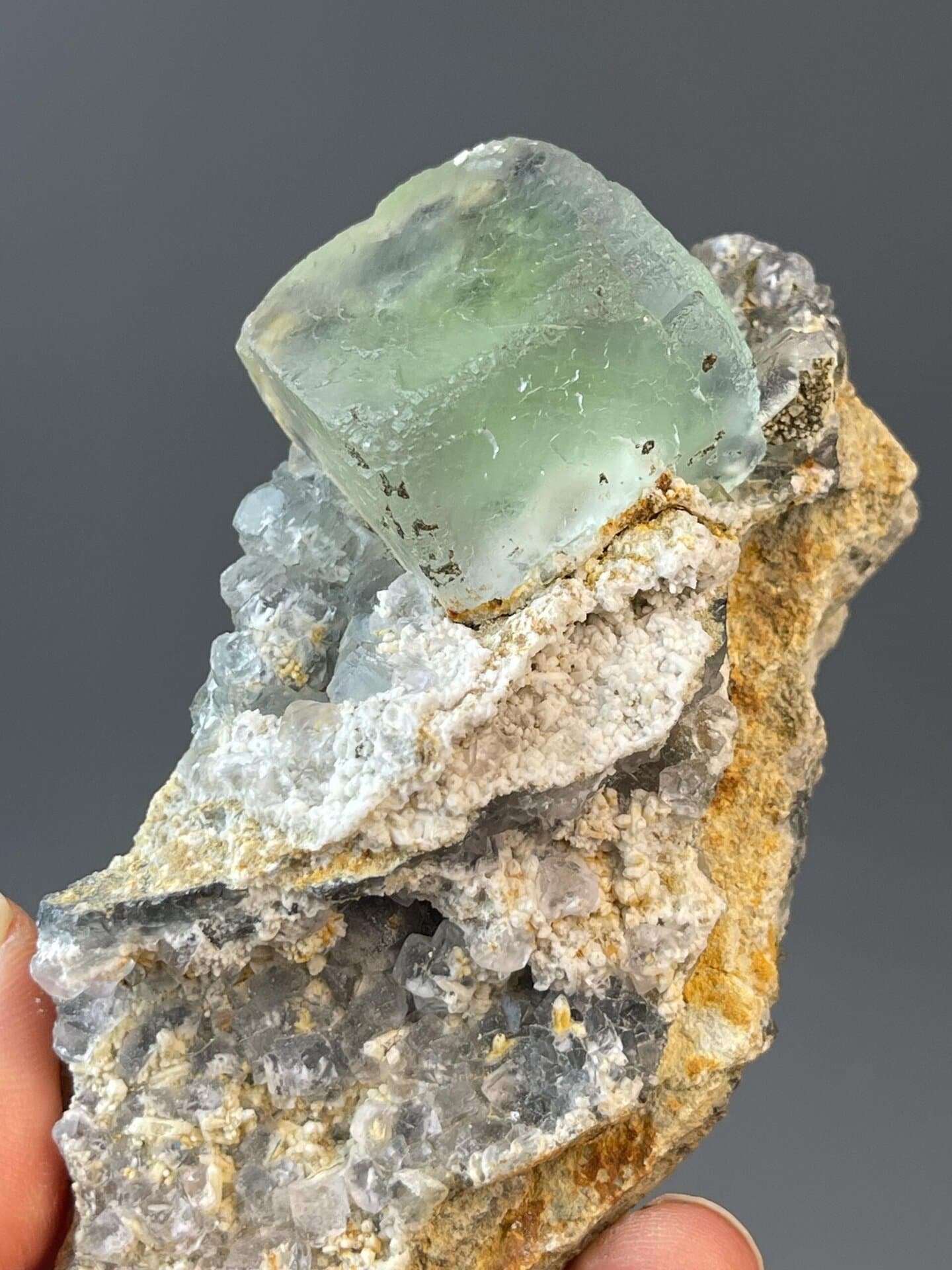 Large well-formed green fluorite cube with sharp crystal faces