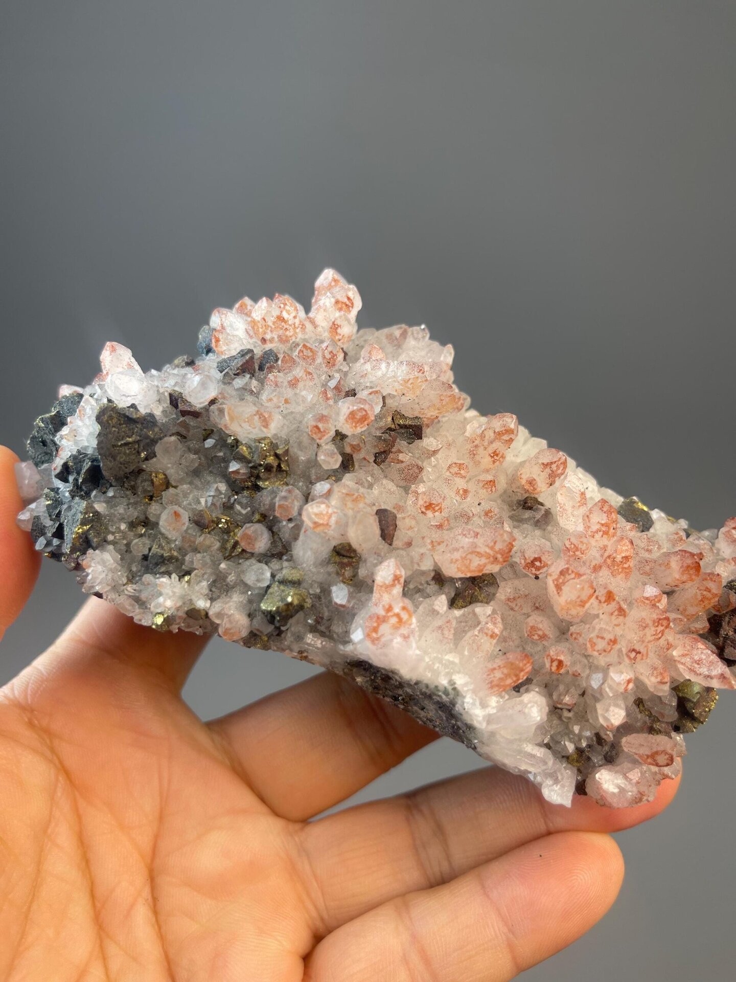 Quartz with iron hematoid inclusions on dark black matrix