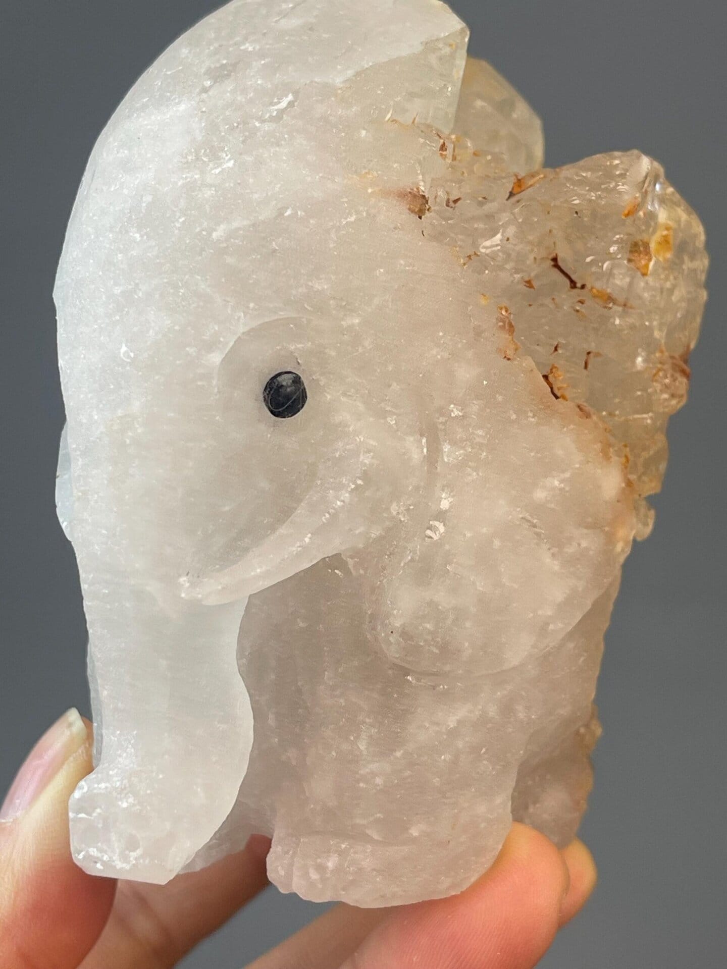 White quartz elephant sculpture with detailed carved surface