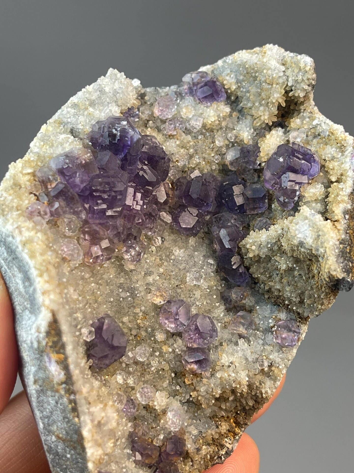 Polished tanzan fluorite spheres with intense purple coloration