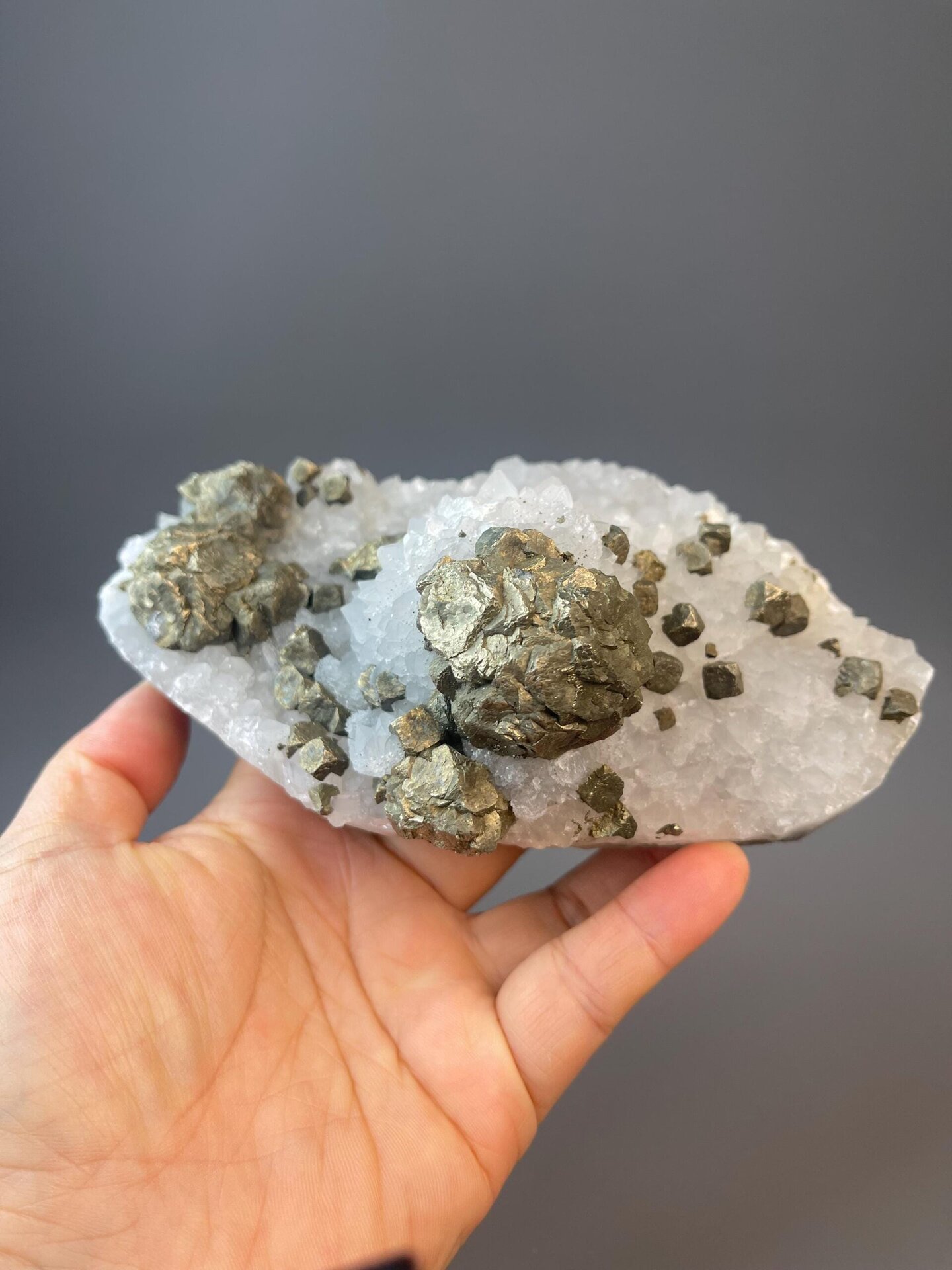 Large chalcopyrite with metallic luster on crystalline quartz