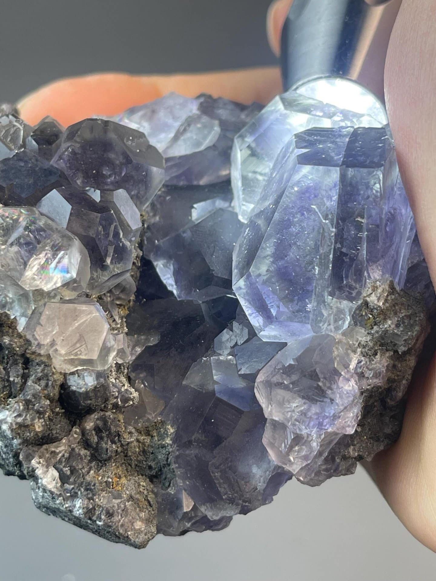 Transparent tanzan fluorite crystal with purple phantom inclusions