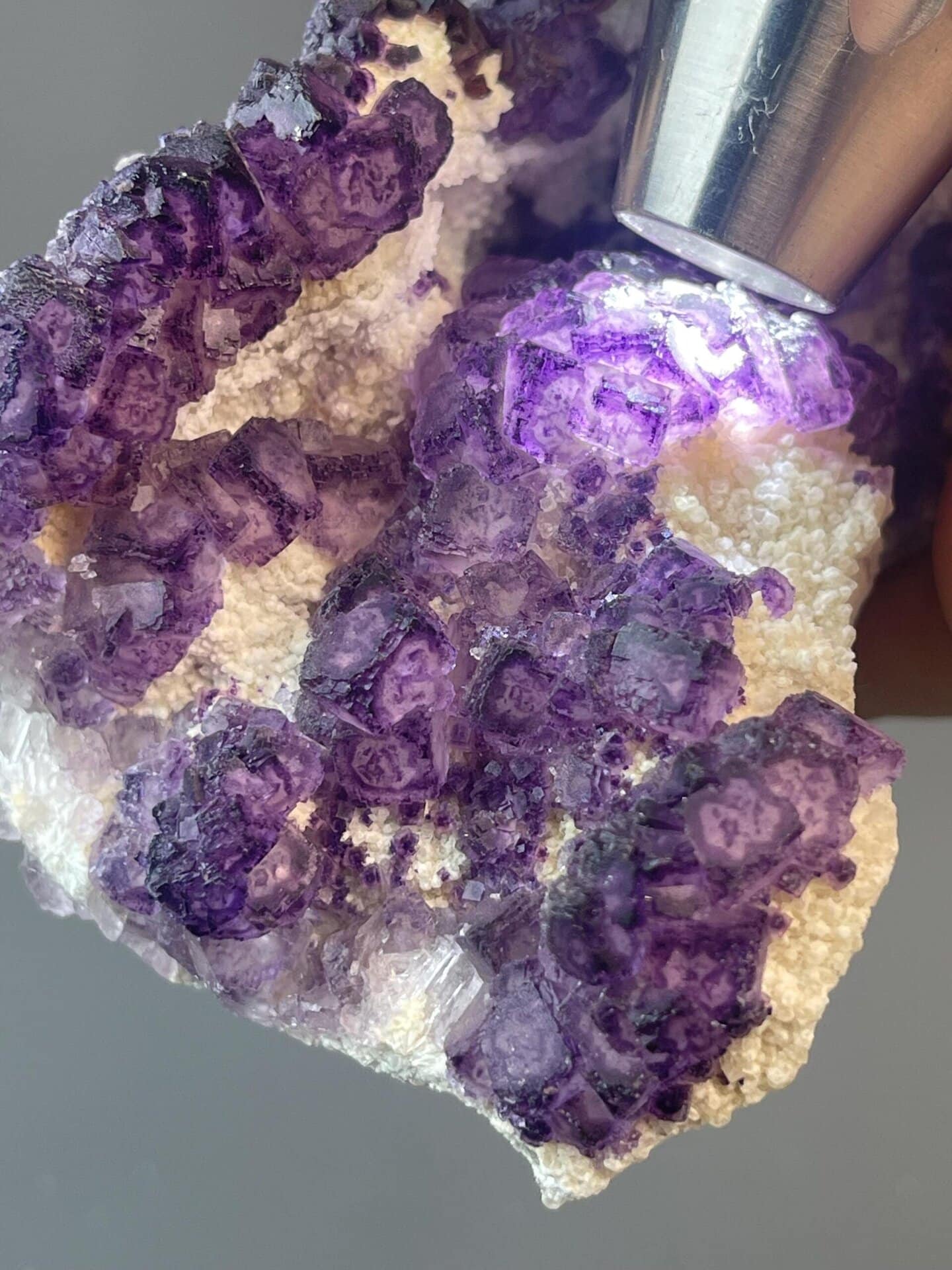 Purple CaF₂ fluorite in distinctive fan arrangement on matrix