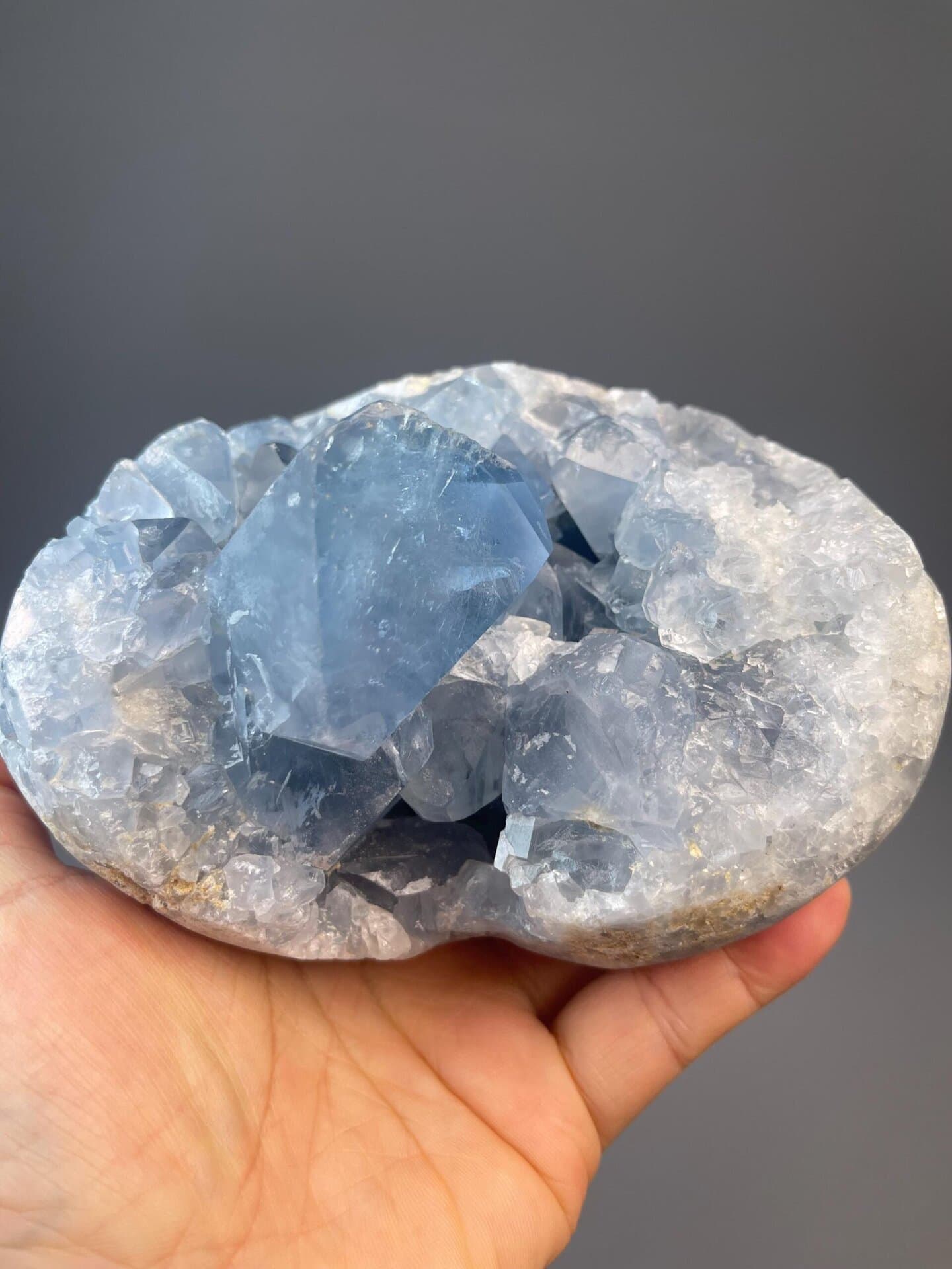 Blue celestite heart with natural crystal formation inside