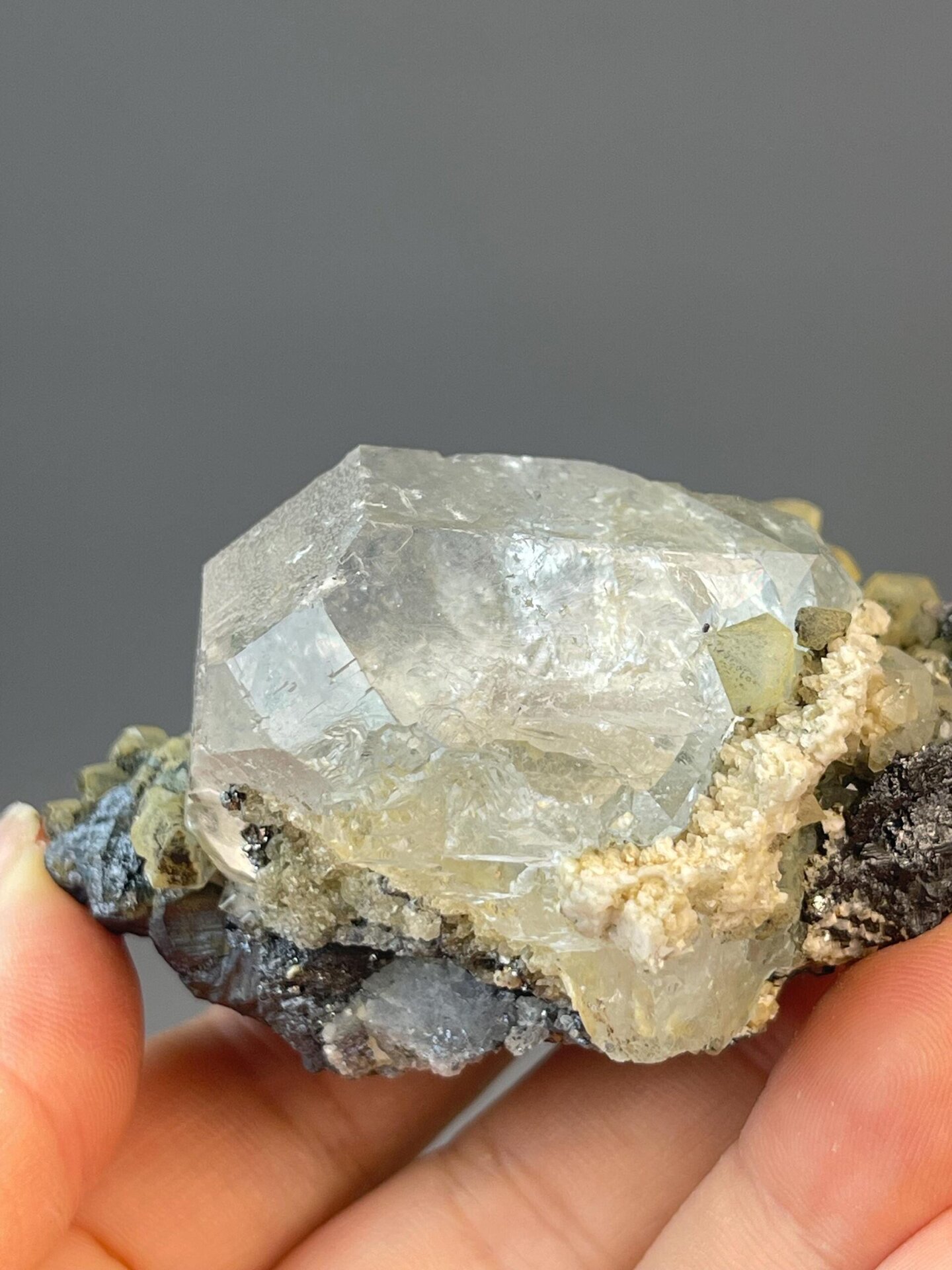 White globular fluorite with metallic cassiterite mineral spots