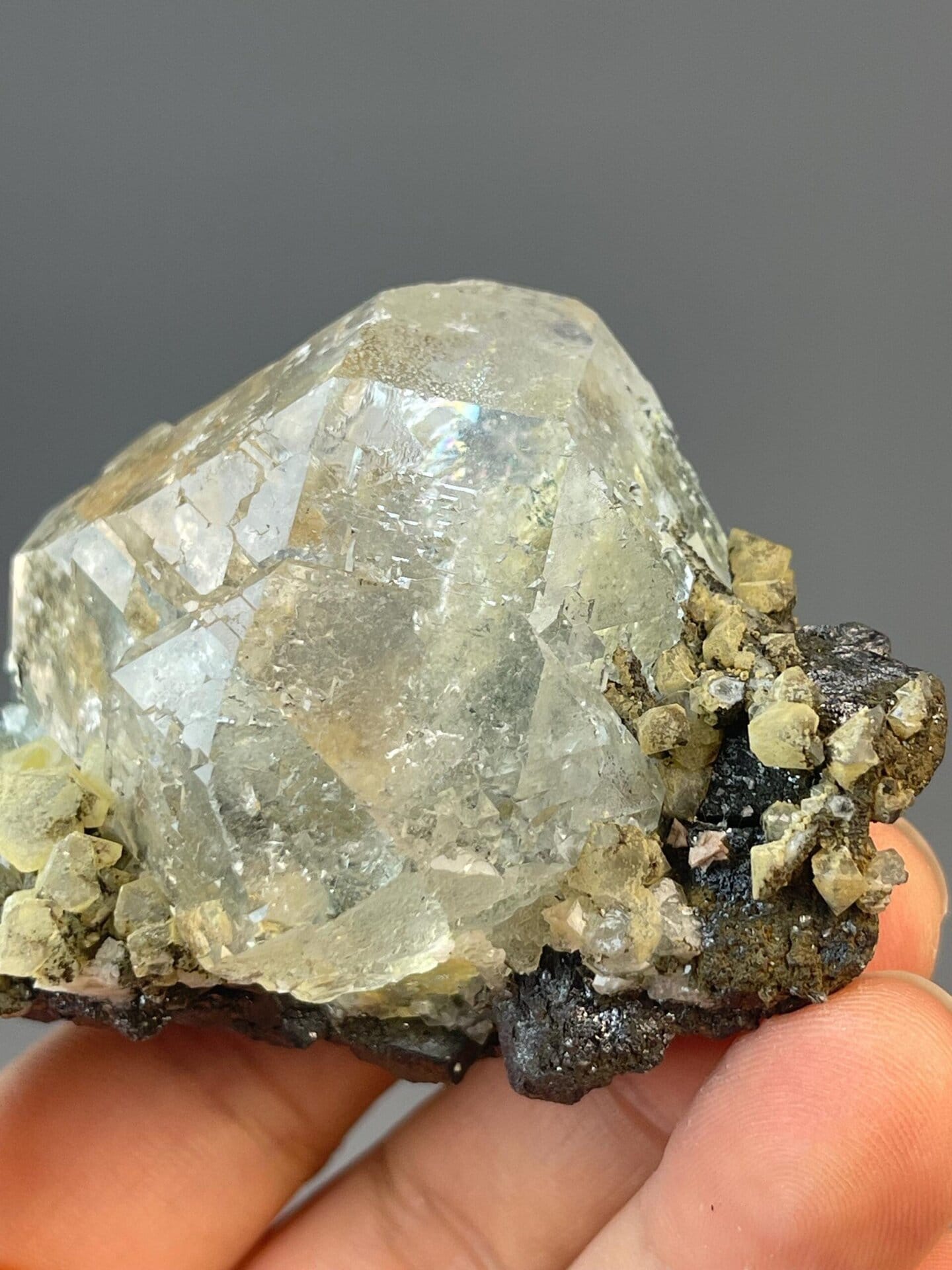 White fluorite sphere with cassiterite, 6.35 oz, vitreous luster