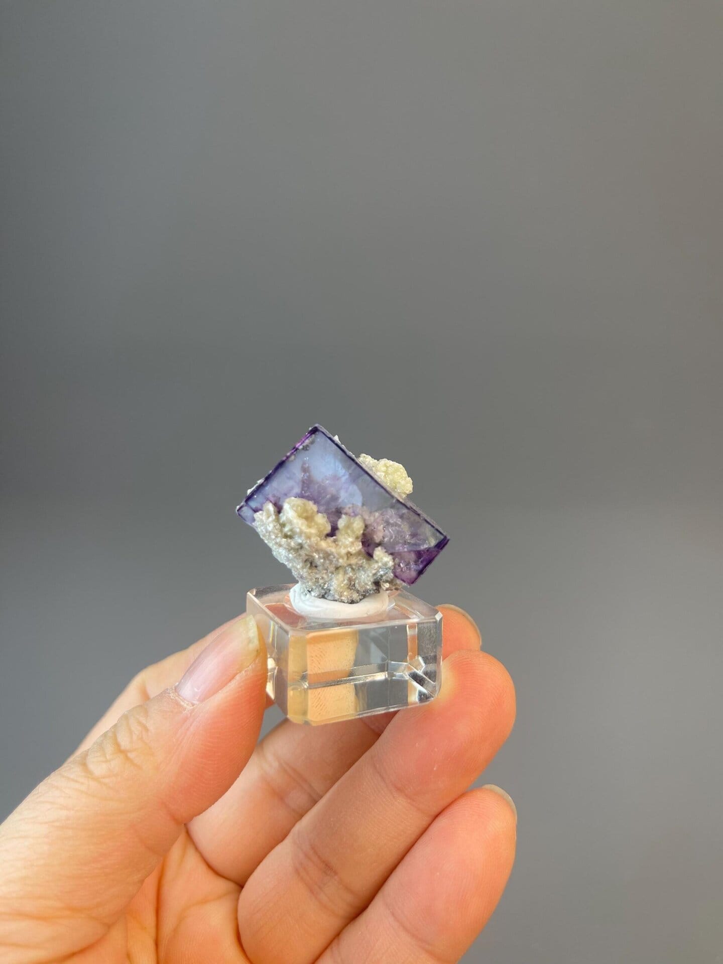 Purple fluorite with visible internal phantom on dolomite matrix