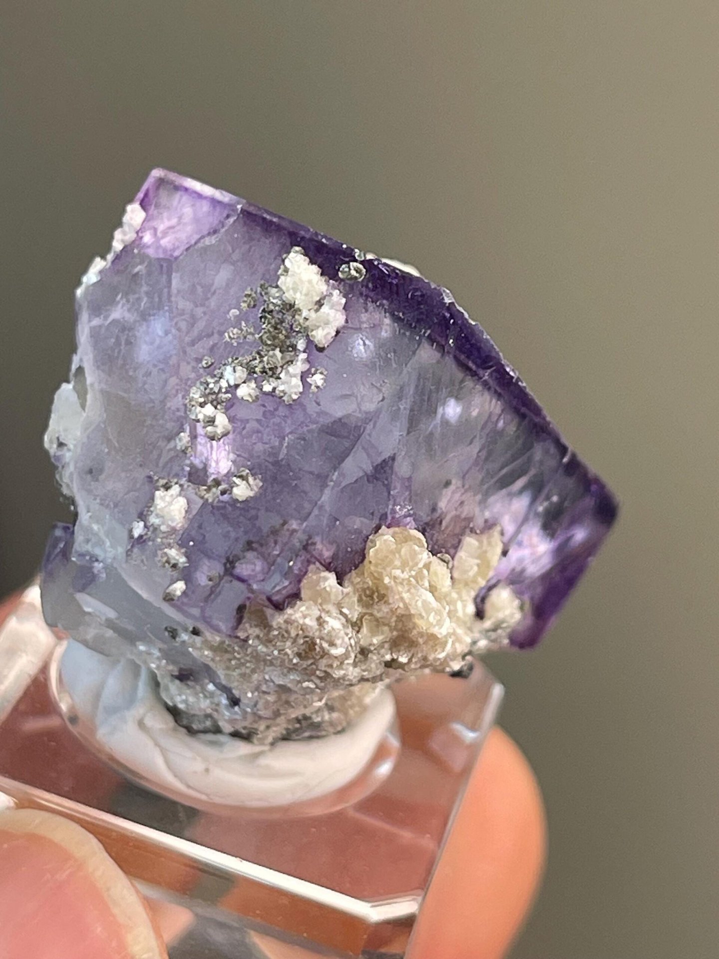 Purple CaF₂ fluorite with clear internal phantom on dolomite