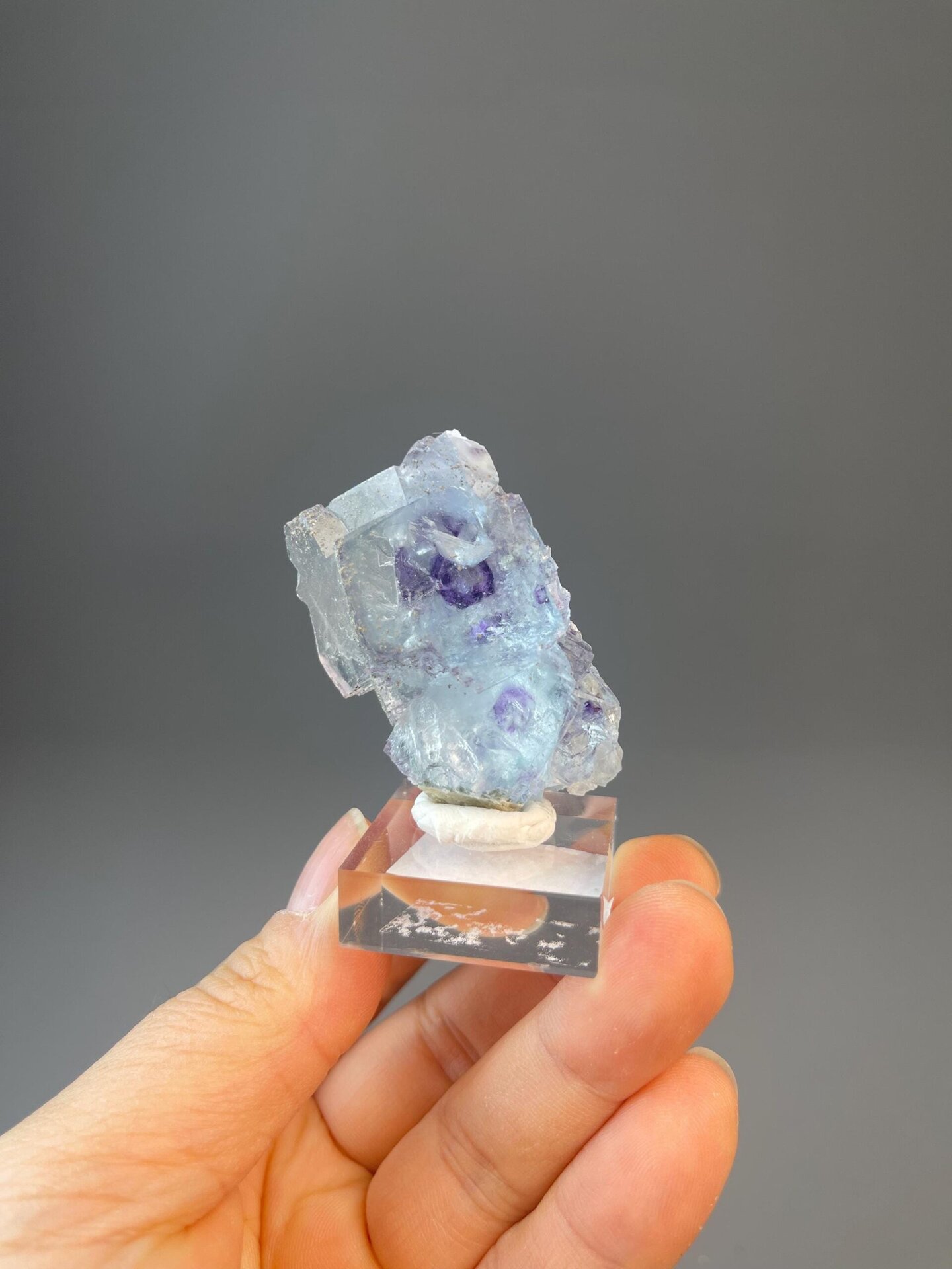 Blue phantom fluorite crystal with vitreous luster and pyrite