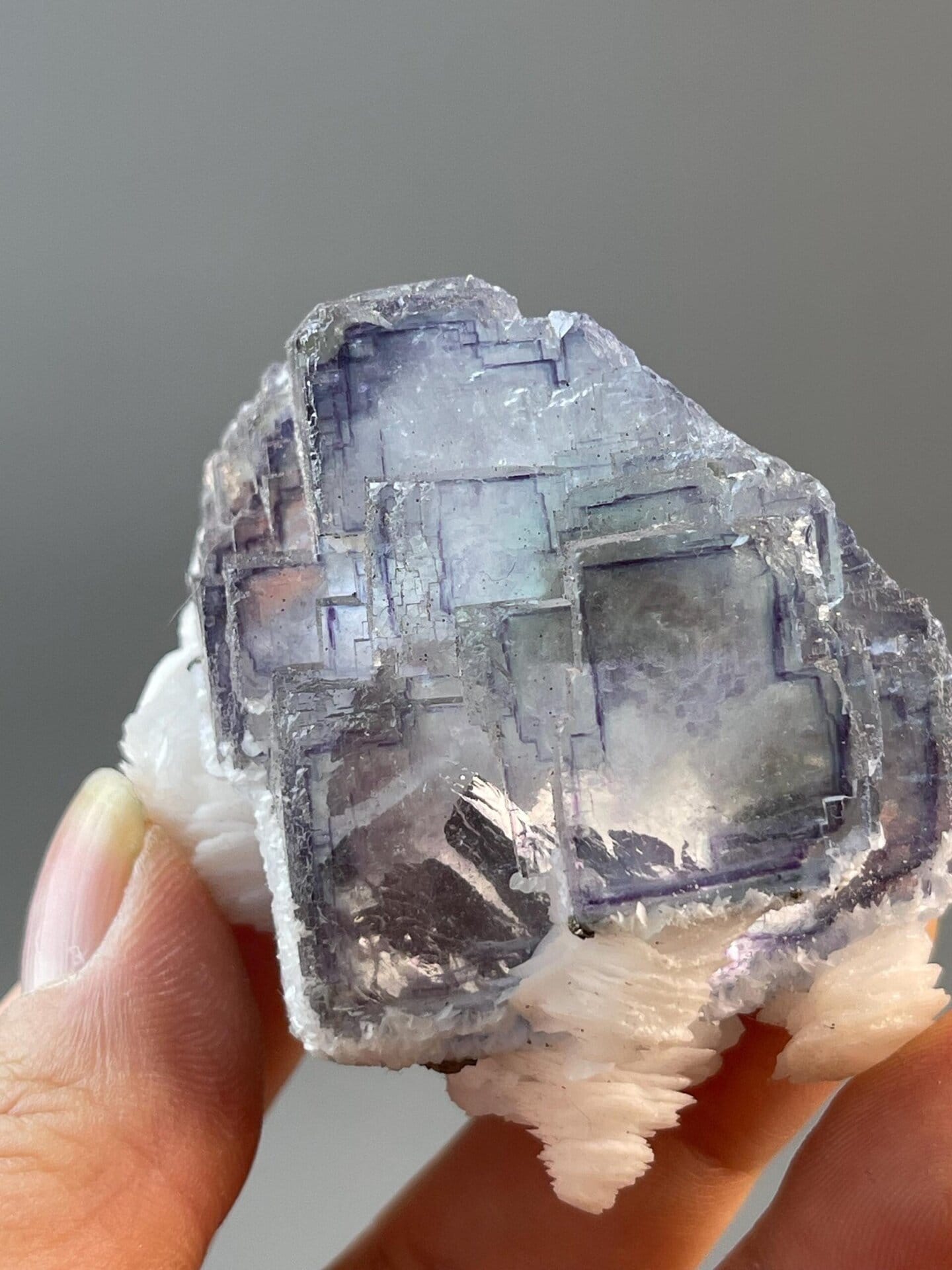 Back view of purple fluorite with calcite specimen