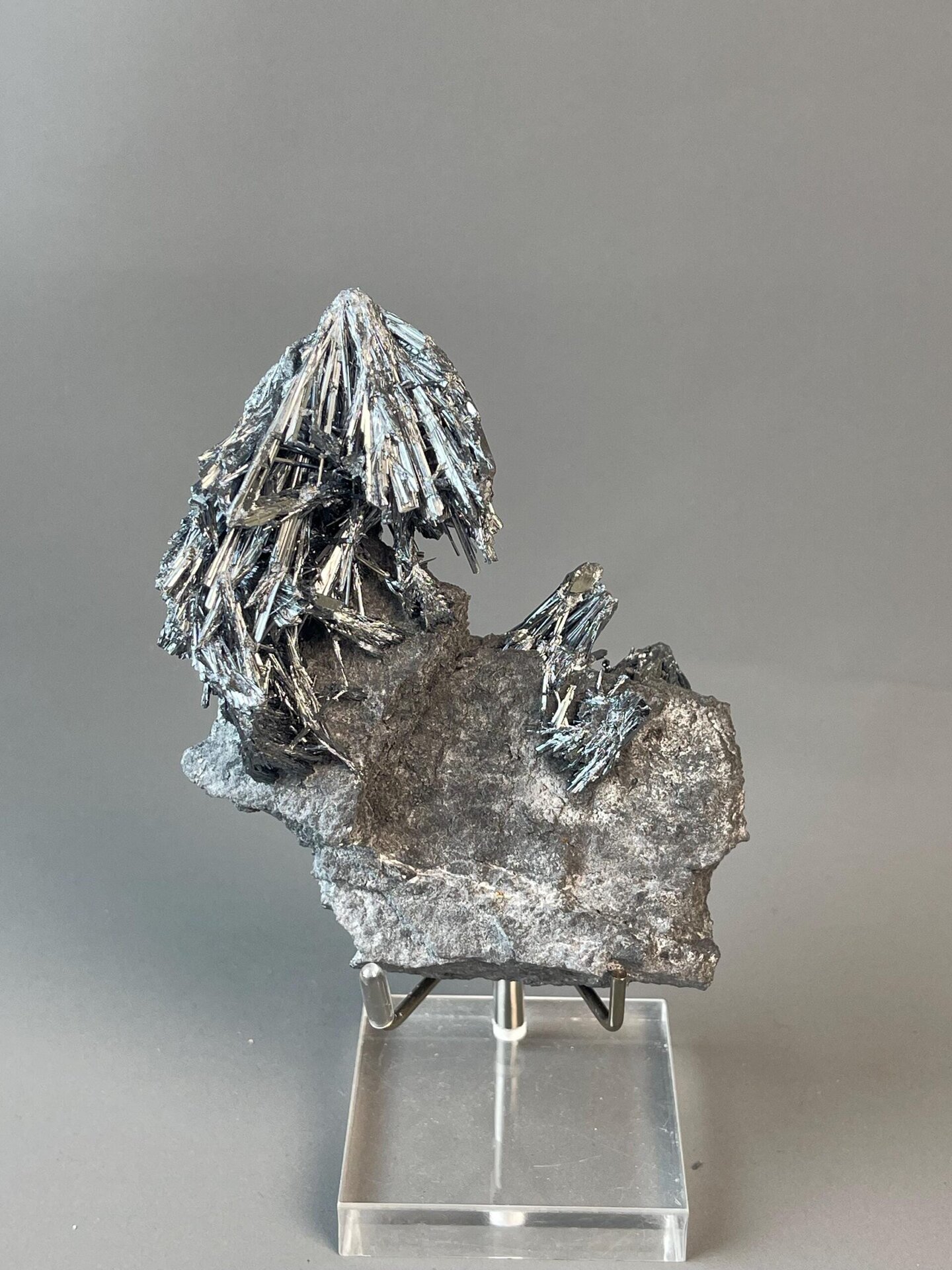 Shimmering metallic luster on stibnite crystals