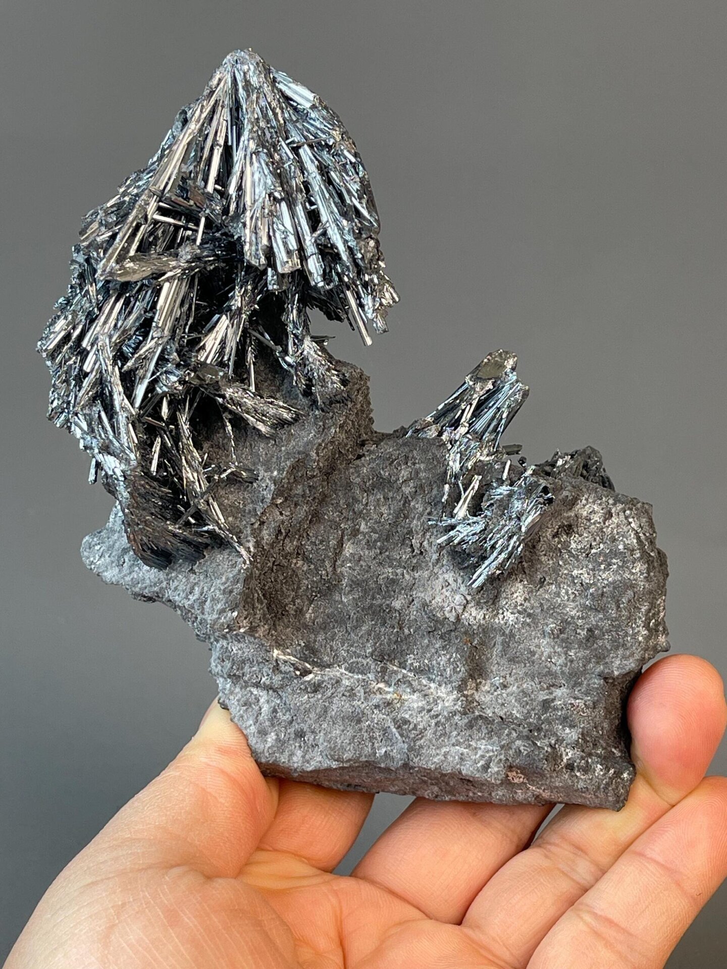 Front view of metallic stibnite crystals from Lengshuijiang