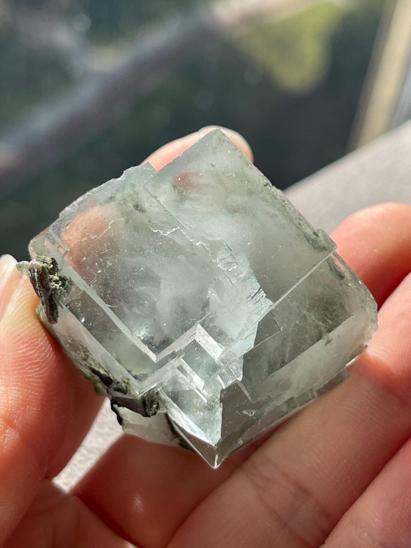 Light green fluorite crystal from YGX under studio light