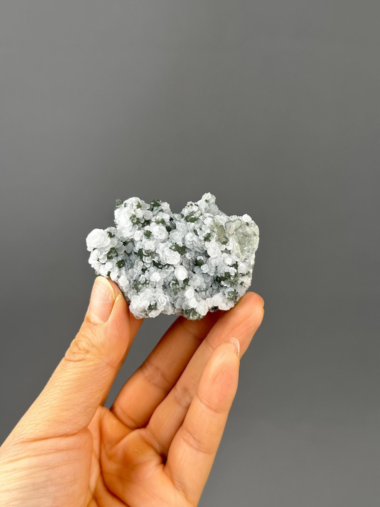 Close-up of flower-form calcite with green quartz
