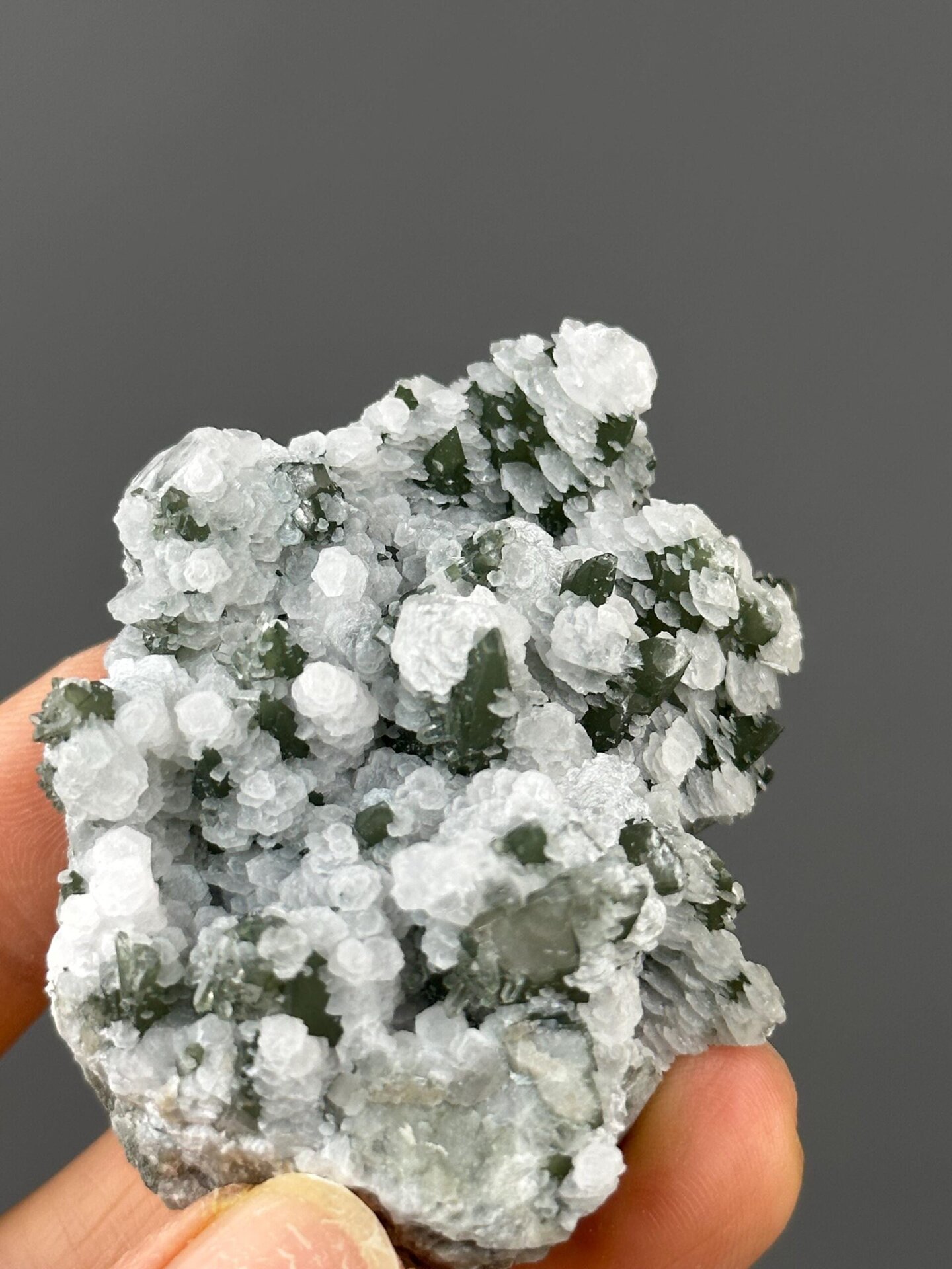Petal-like calcite formation with green quartz detail