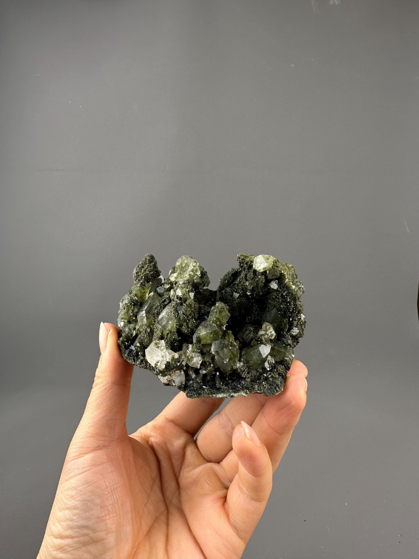 Close-up of epidote inclusions inside garden quartz