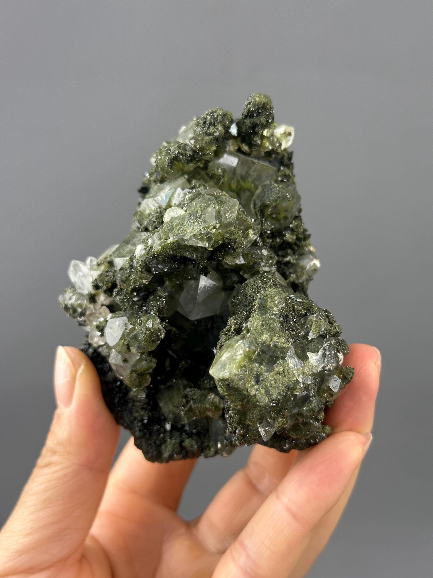 Green epidote inclusion detail inside quartz crystal