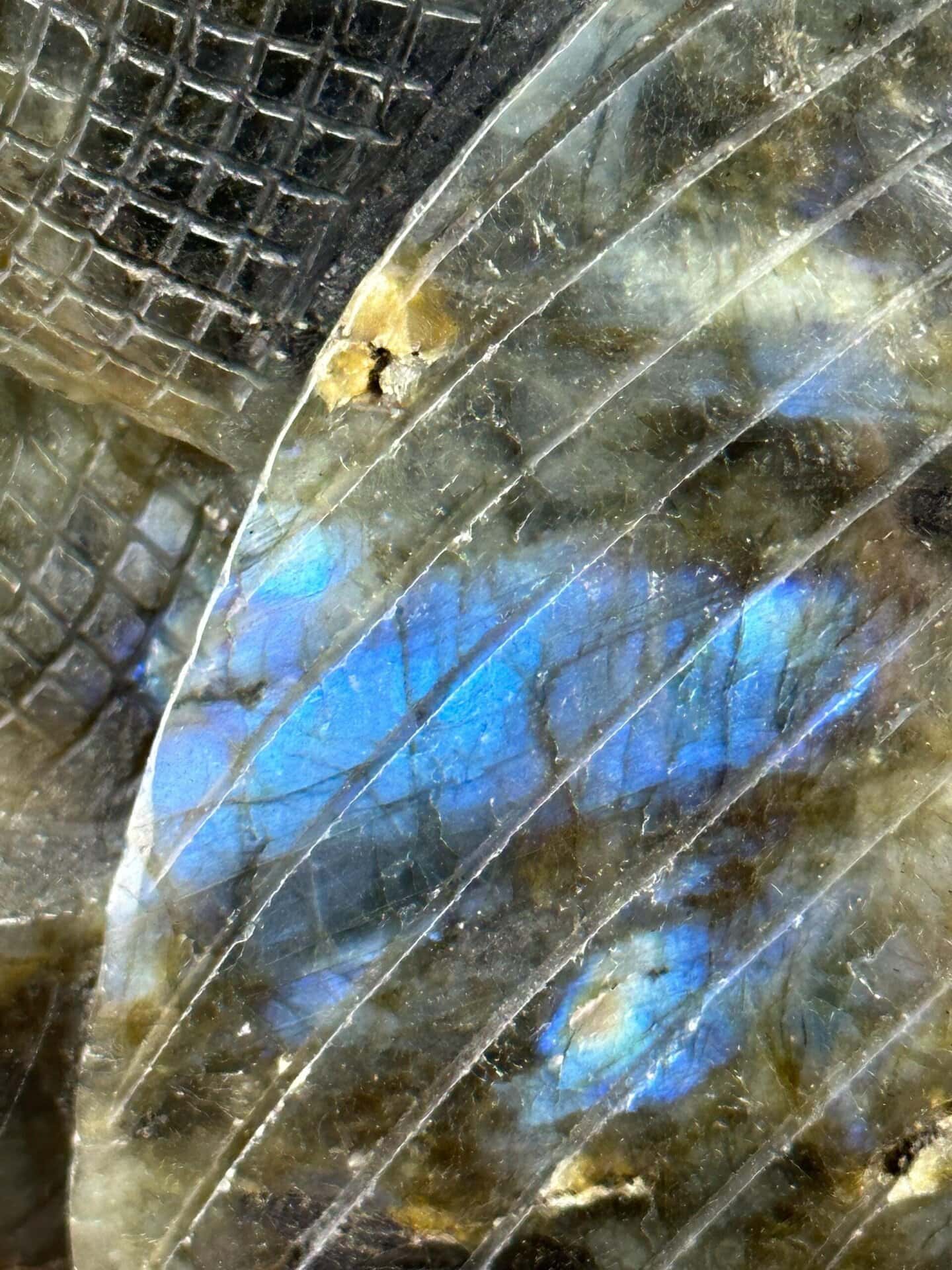Wave carving detail on labradorite surface