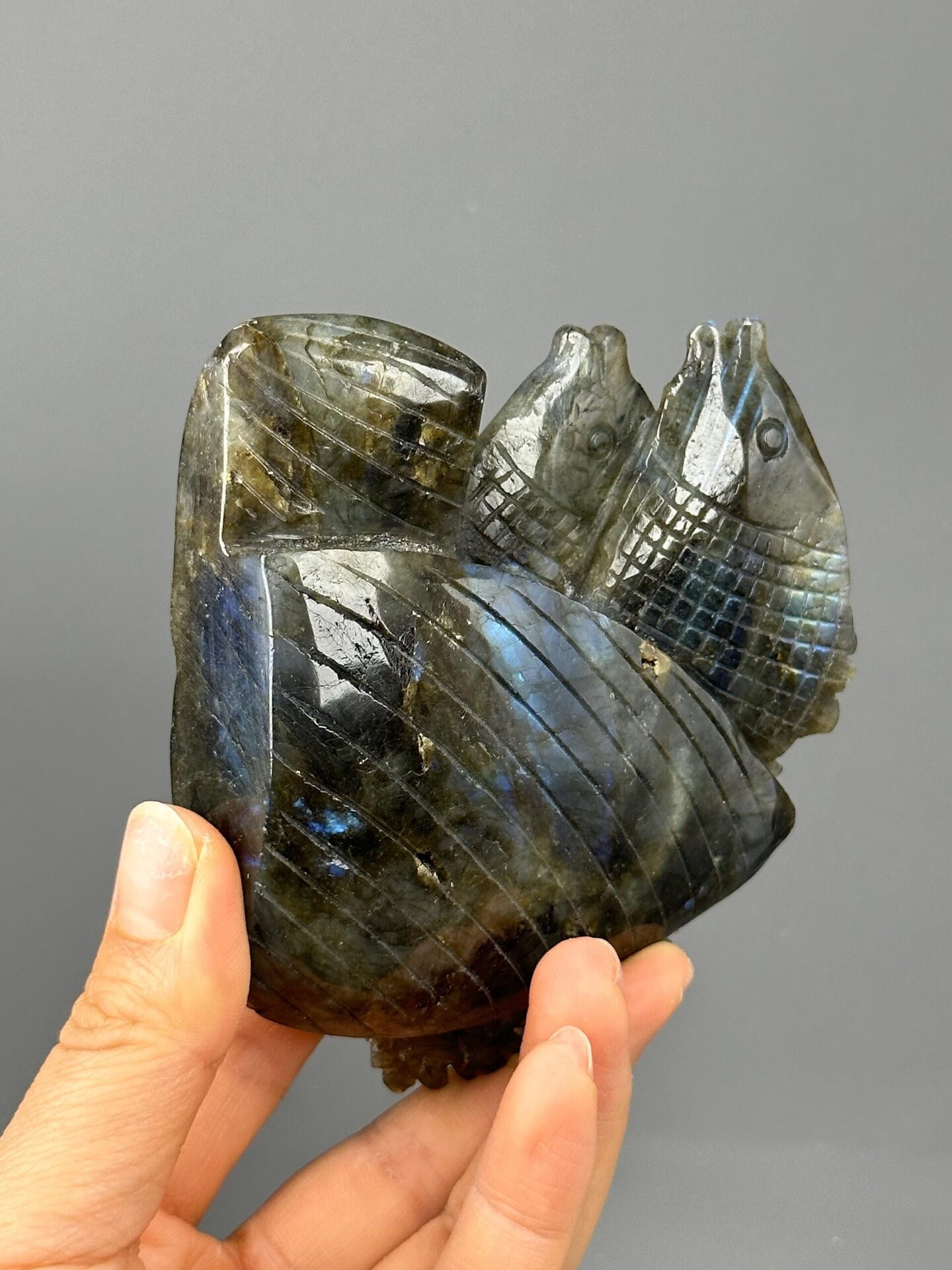 Full carved labradorite sculpture on white background