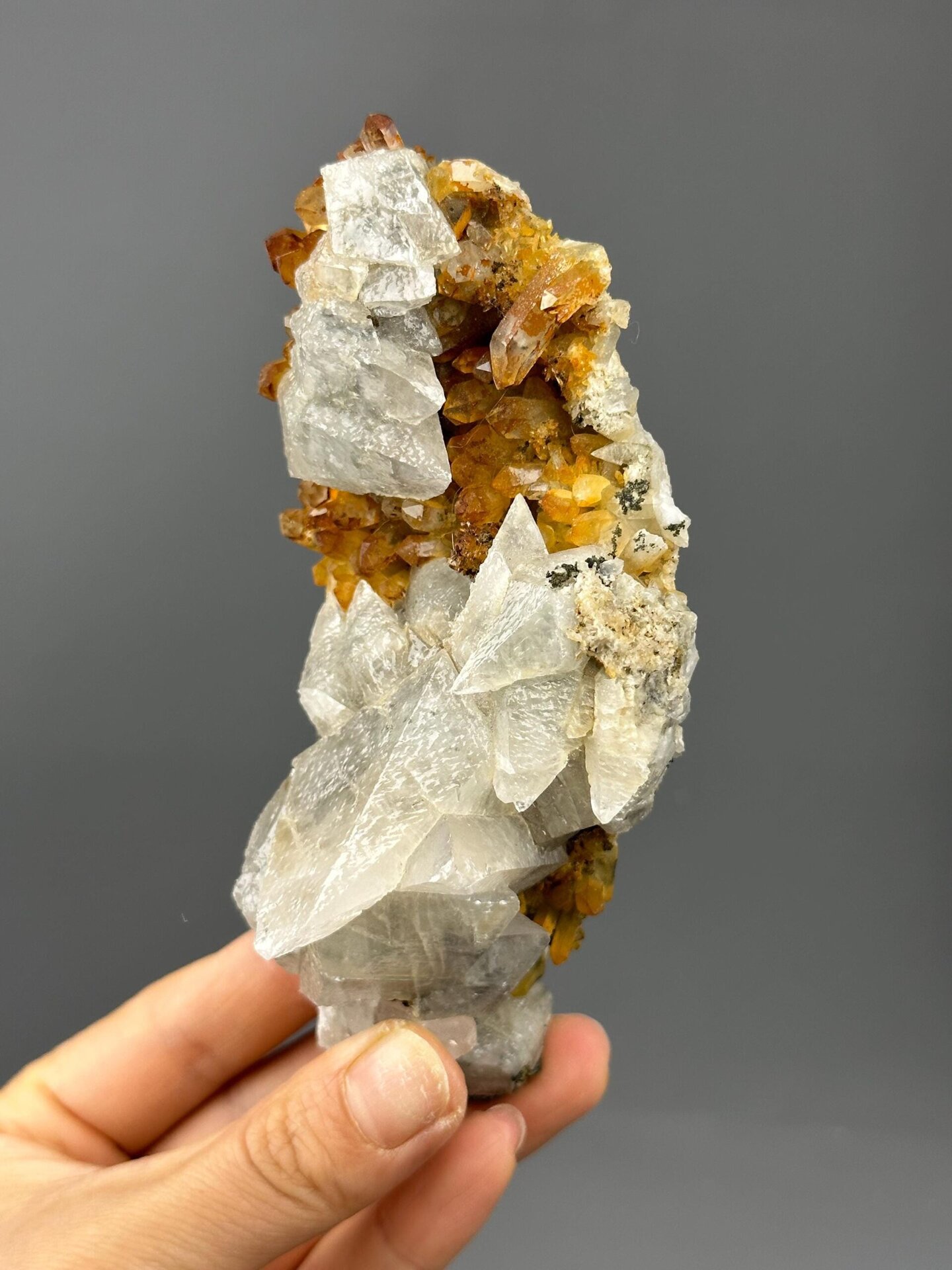 Side view of pink needle calcite cluster Hubei