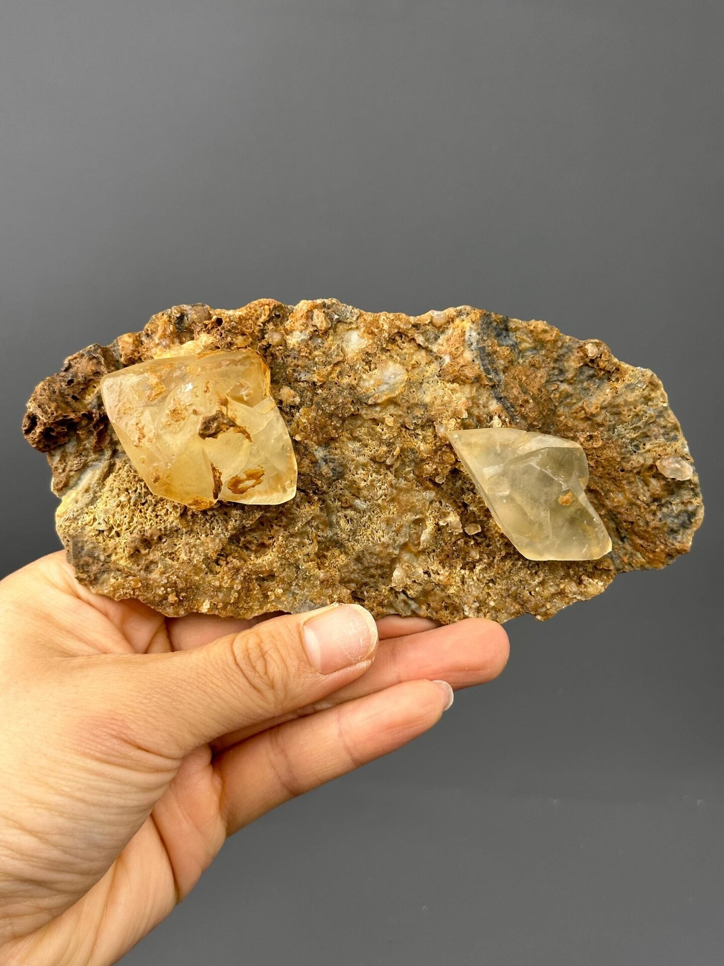 Full view of twin calcite on matrix specimen
