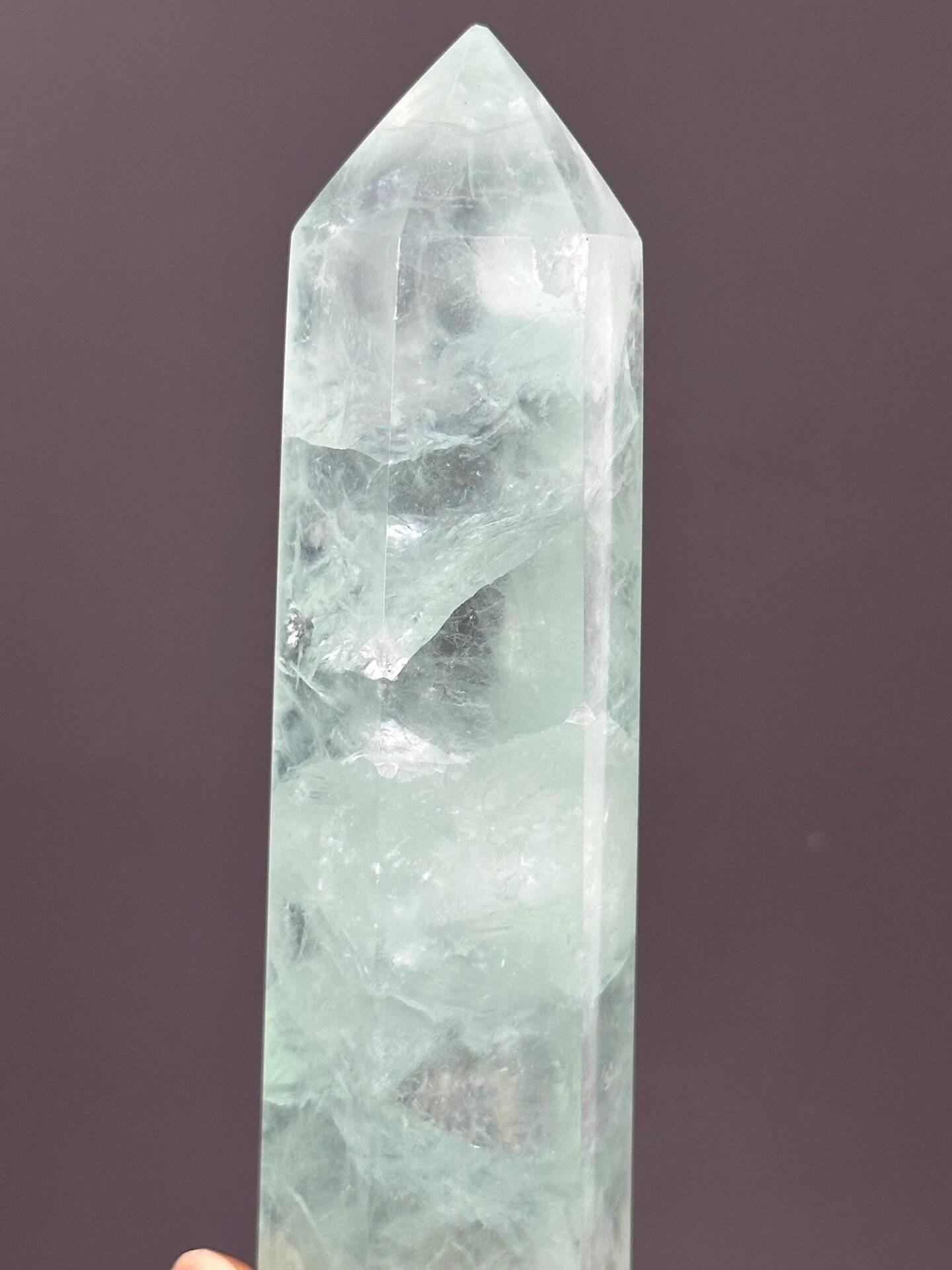 Top point of polished green fluorite tower