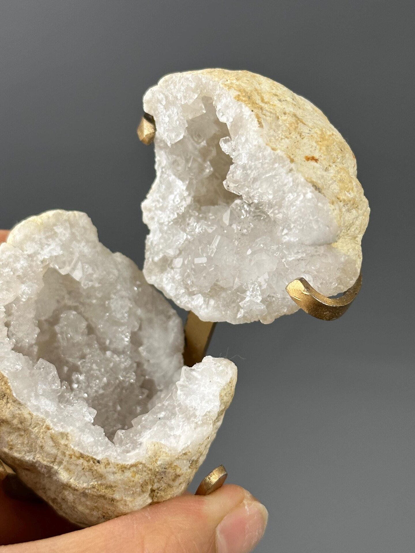 Top view of quartz geode opening on gold stand