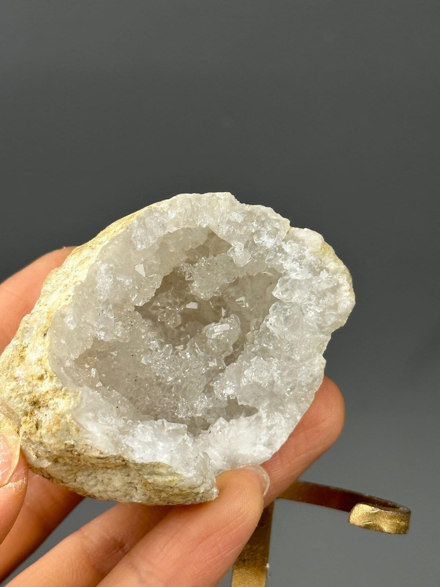 Interior druzy crystals of gold-mounted quartz geode
