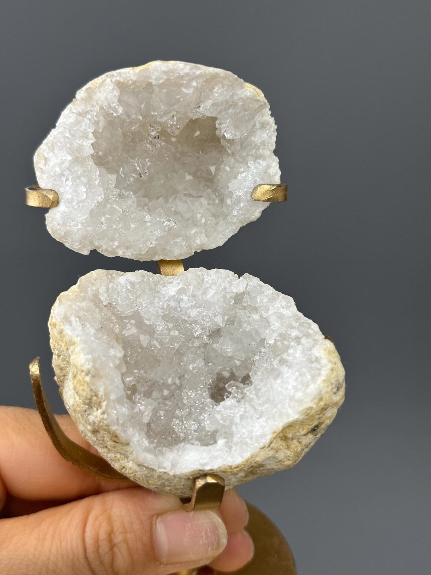 Quartz geode on decorative gold metal display base