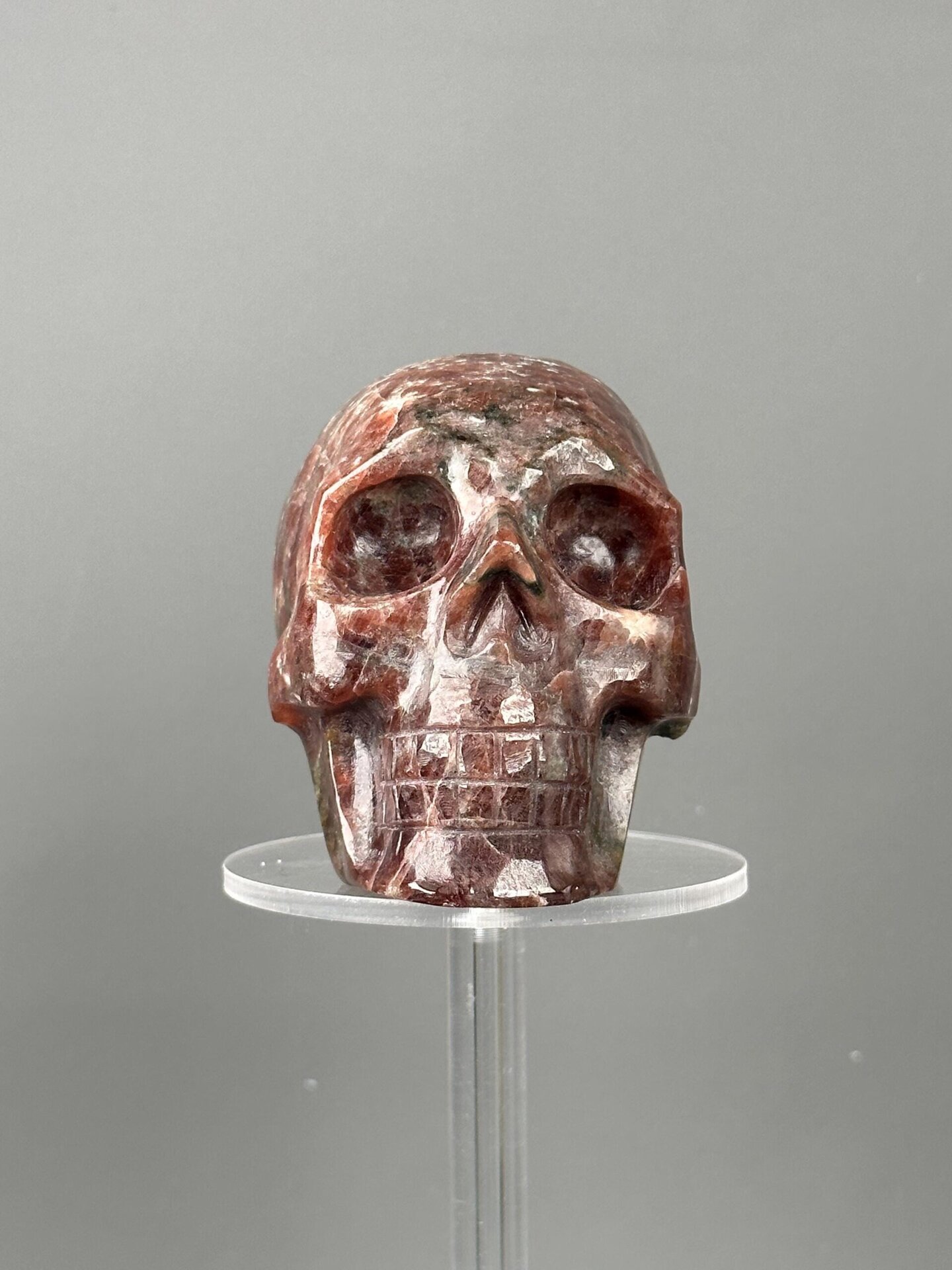 Red garnet skull base carved underside