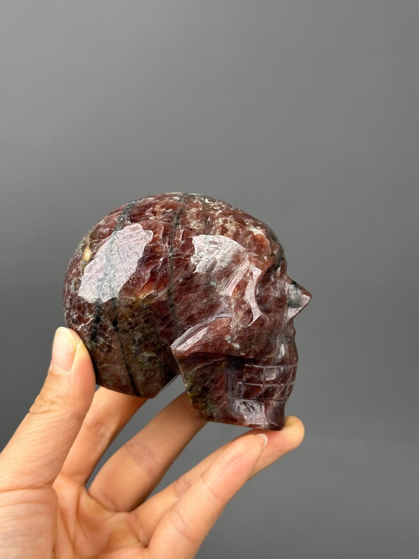 Garnet skull side profile hand-carved
