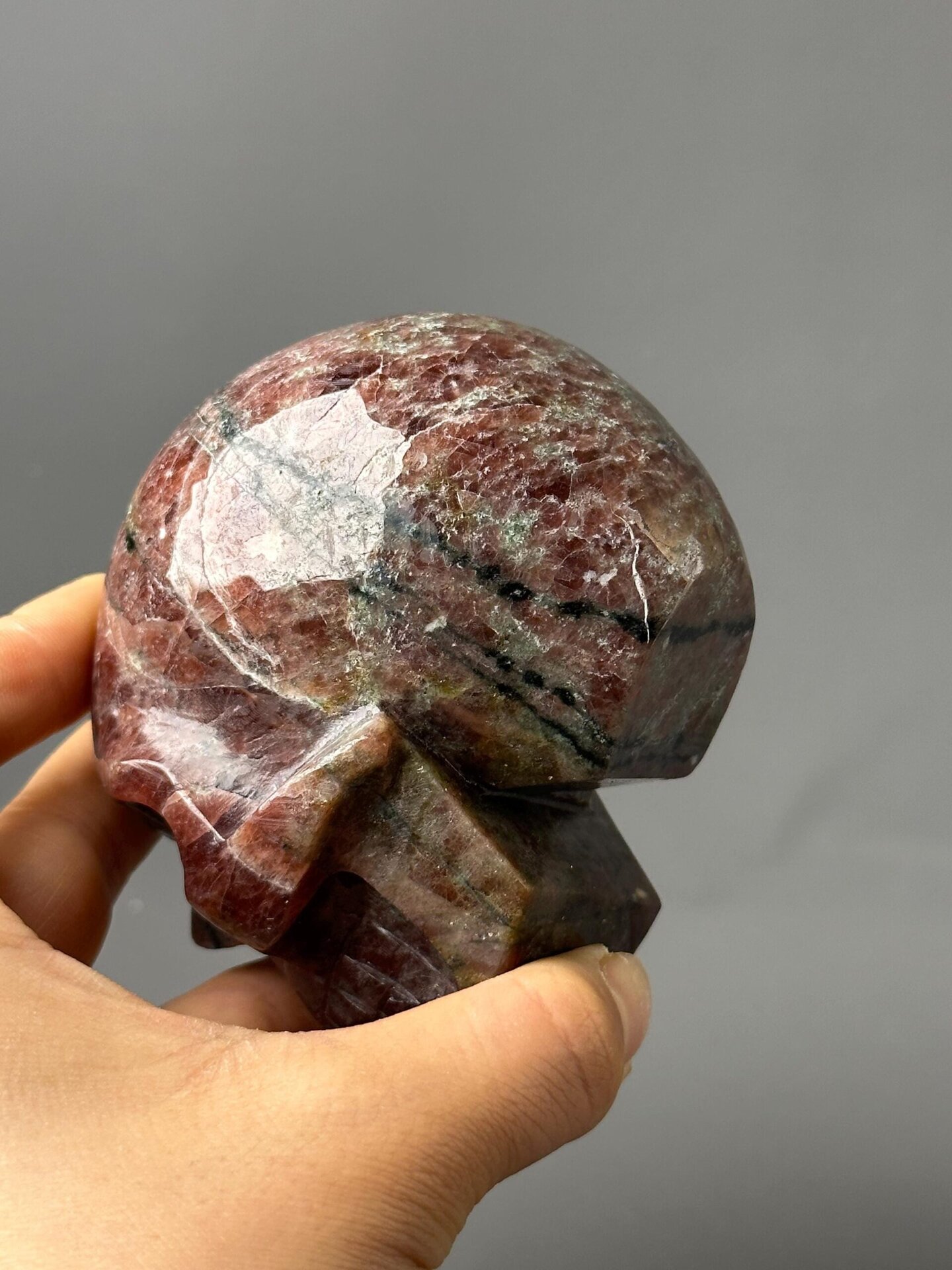 Full red garnet skull on white background