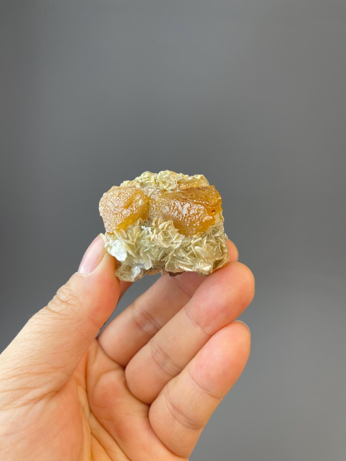 White scheelite tungstate crystals in twinned octahedral form