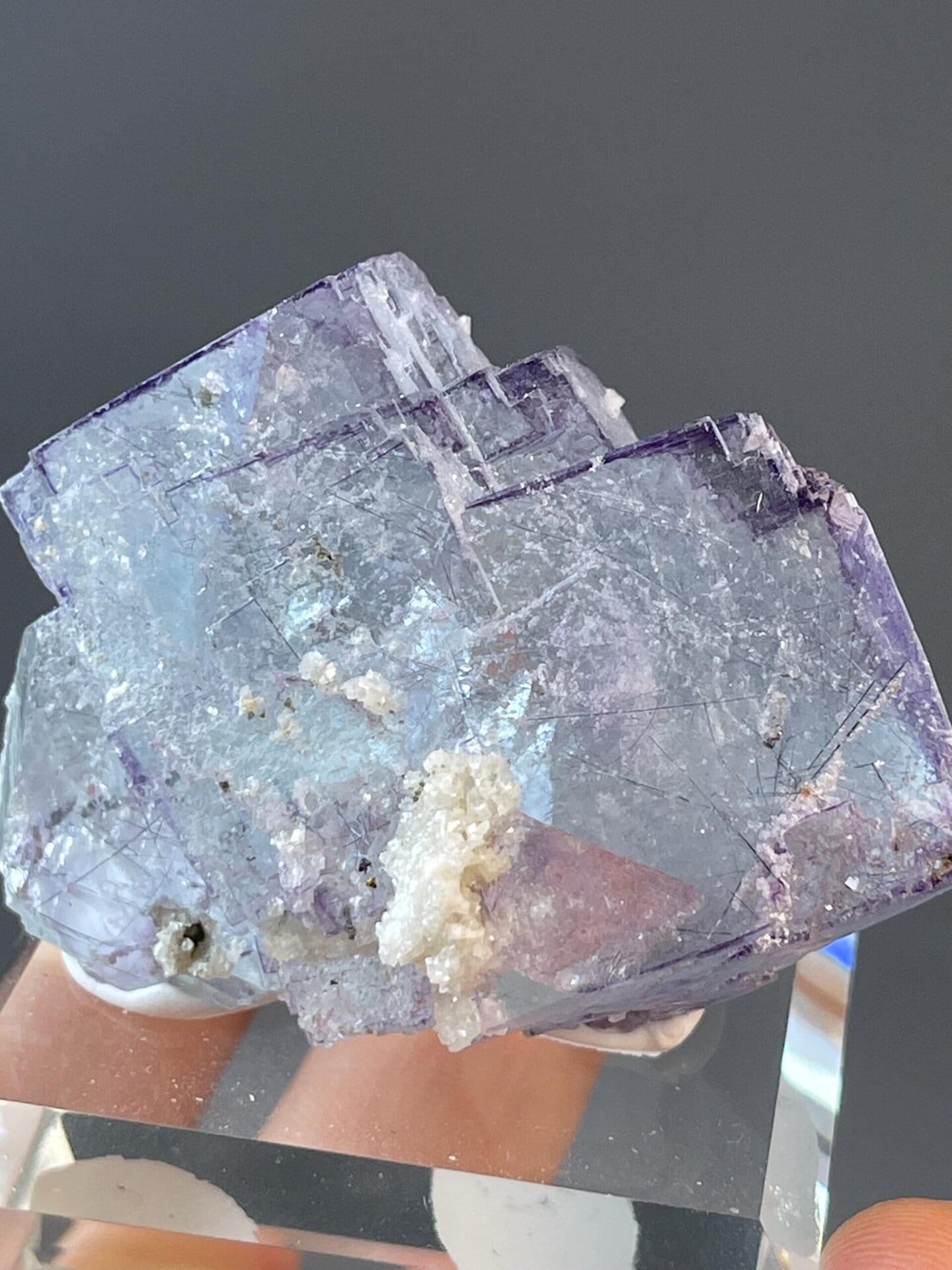 Translucent blue-purple fluorite with stepped face and needles