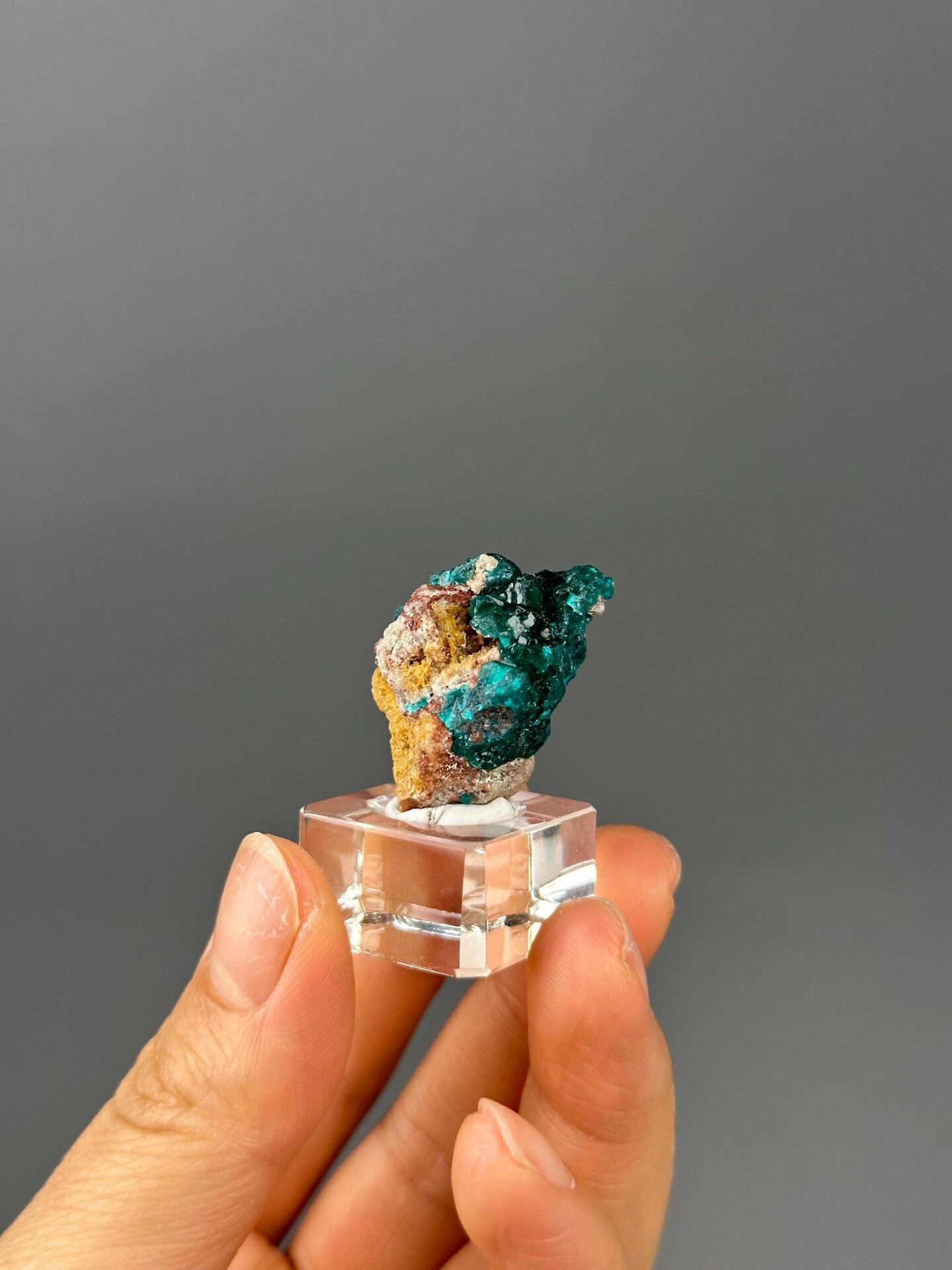 Deep green dioptase crystal faces close-up