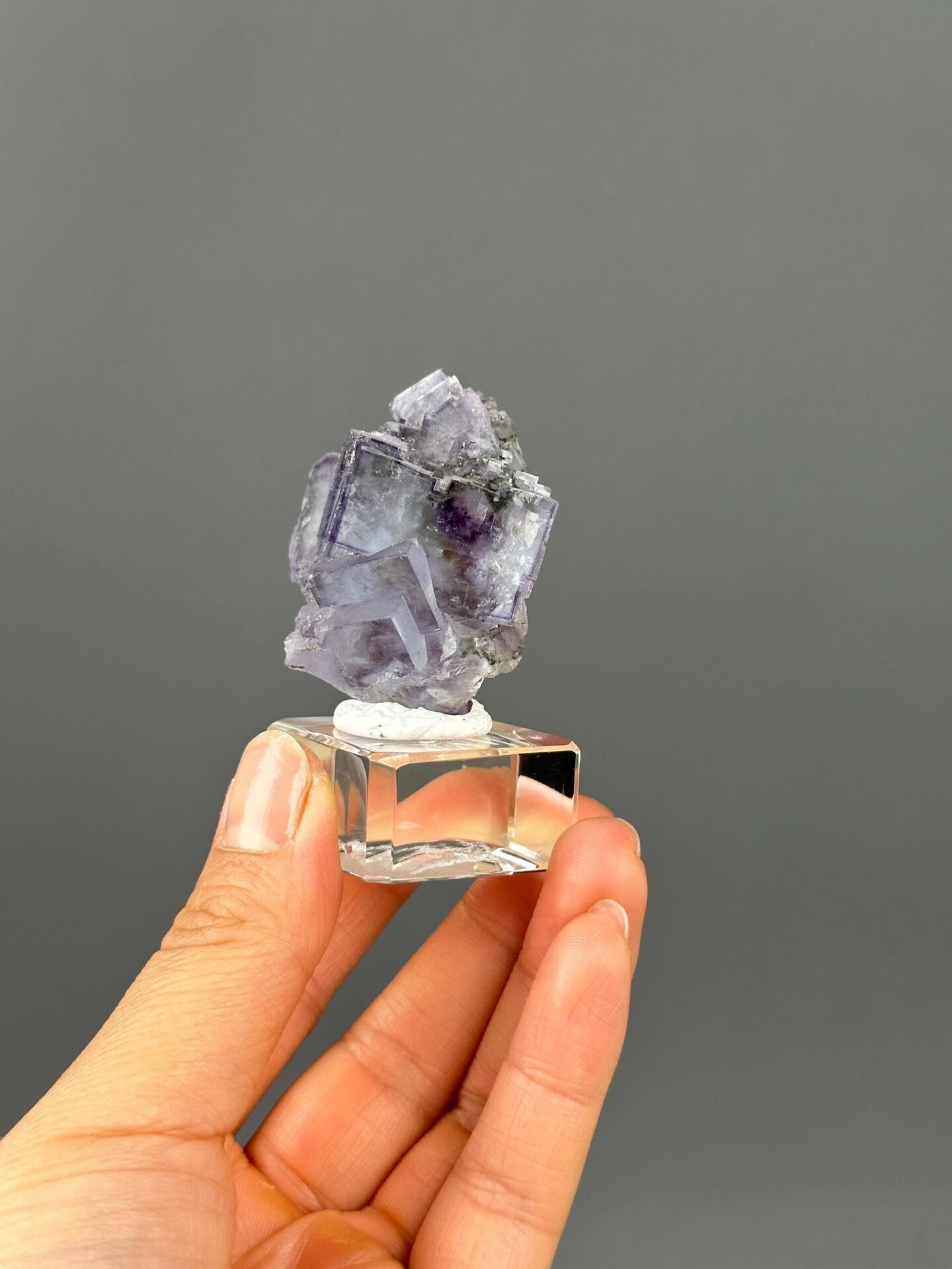 Twin fluorite crystal faces and matrix base
