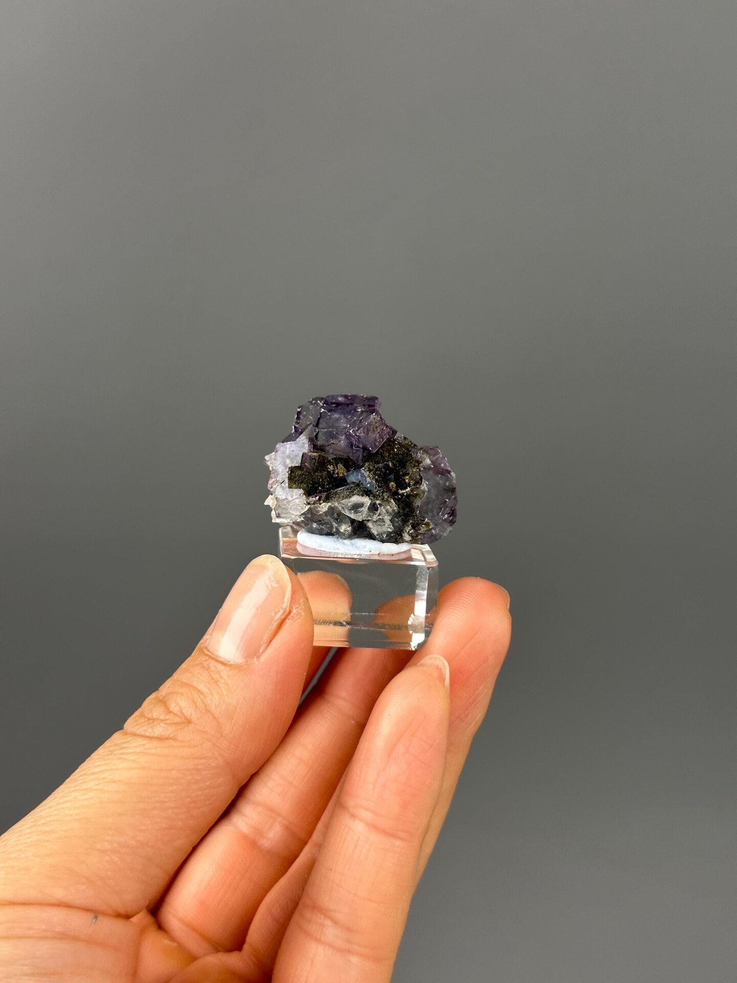 Epidote inclusions in fluorite close-up detail